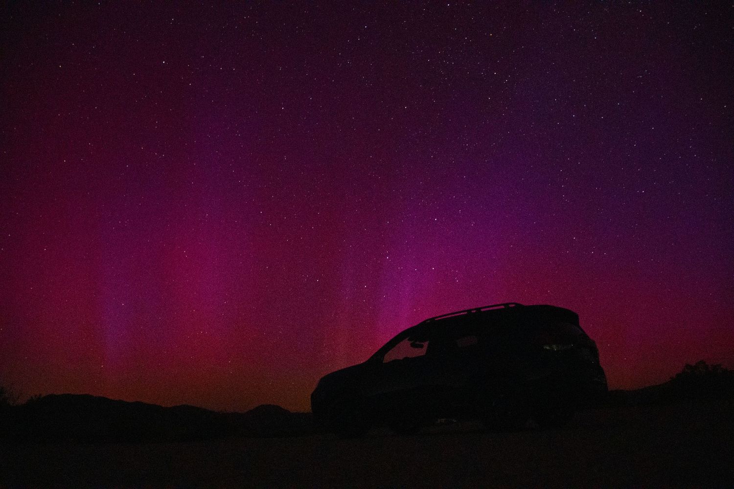 Subaru Forester Wilderness with northern lights over Johnson Valley