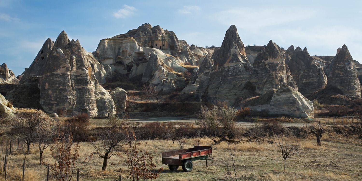 Panoramic view of rugged rock formations in a mountainous desert landscape.