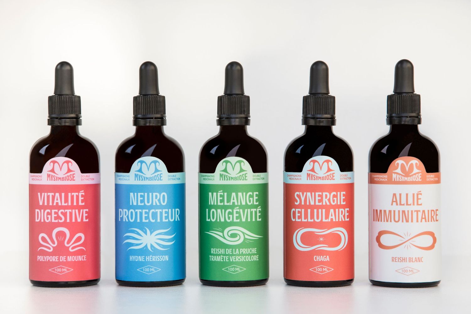 Collection of colorful wellness supplement bottles with stylish modern branding.