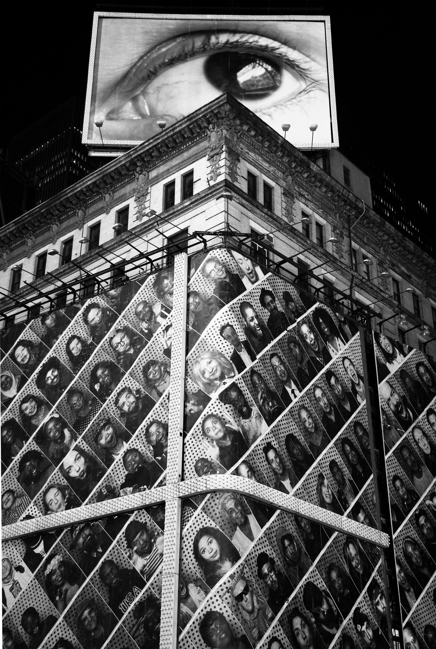 Black and white architectural pattern showing diagonal beams and repeated geometric elements in a building facade.