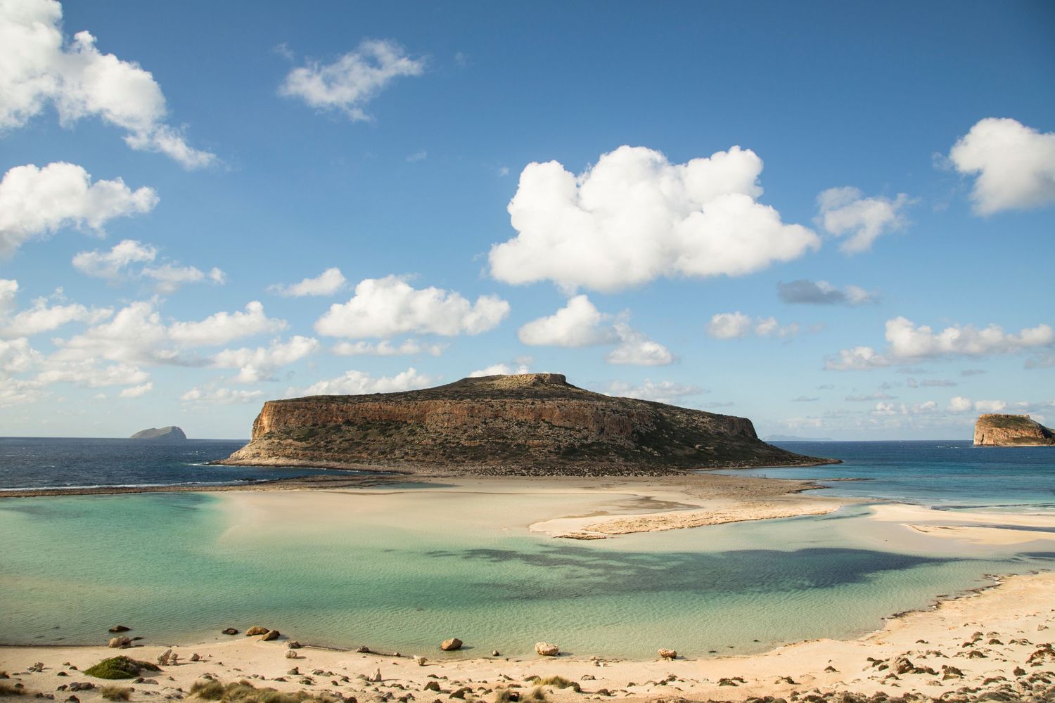 Panoramic view of a pristine coastal landscape with sandy beaches and turquoise waters.
