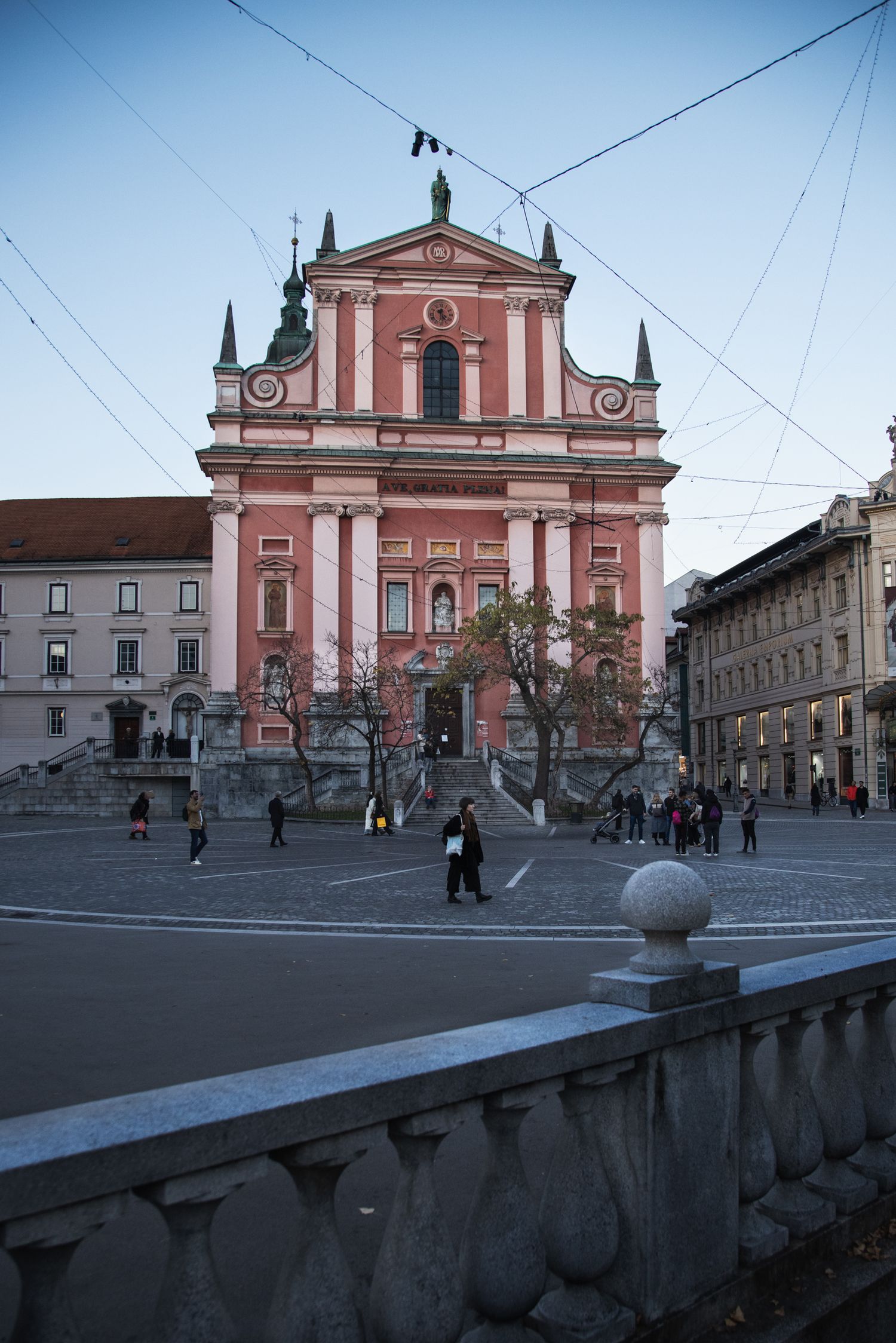 Pink Franciscan Church of the Annunciation in Preseren Square, Ljubljana, Slovenia at dusk.