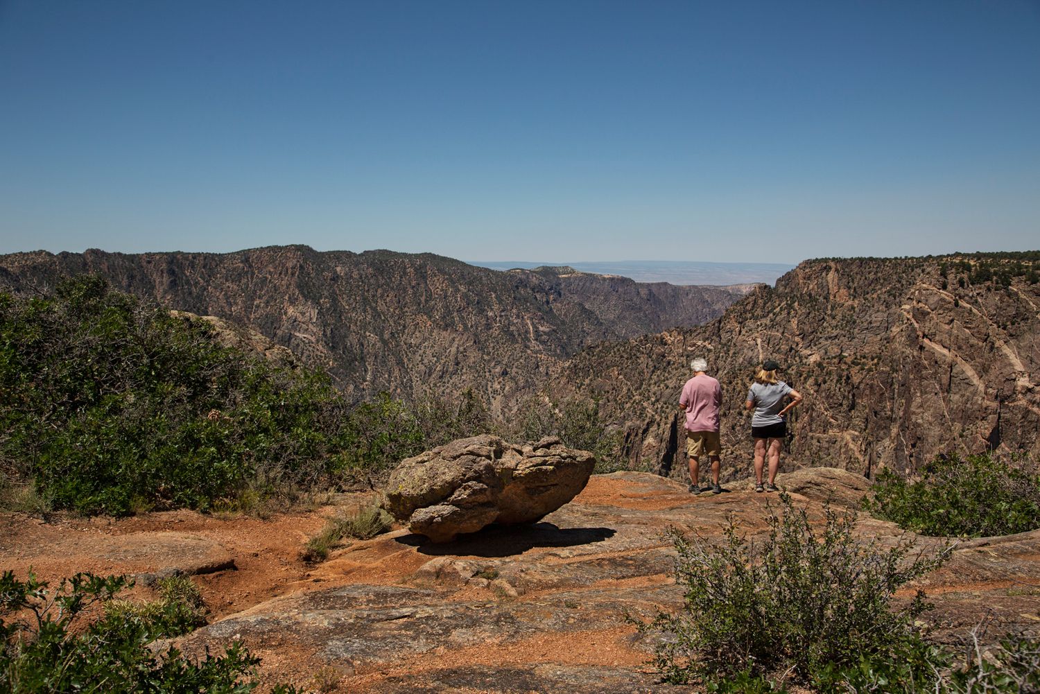 Scenic overlook views of the Black Canyon of the Gunnison National Park showing dramatic cliffs and deep gorges.