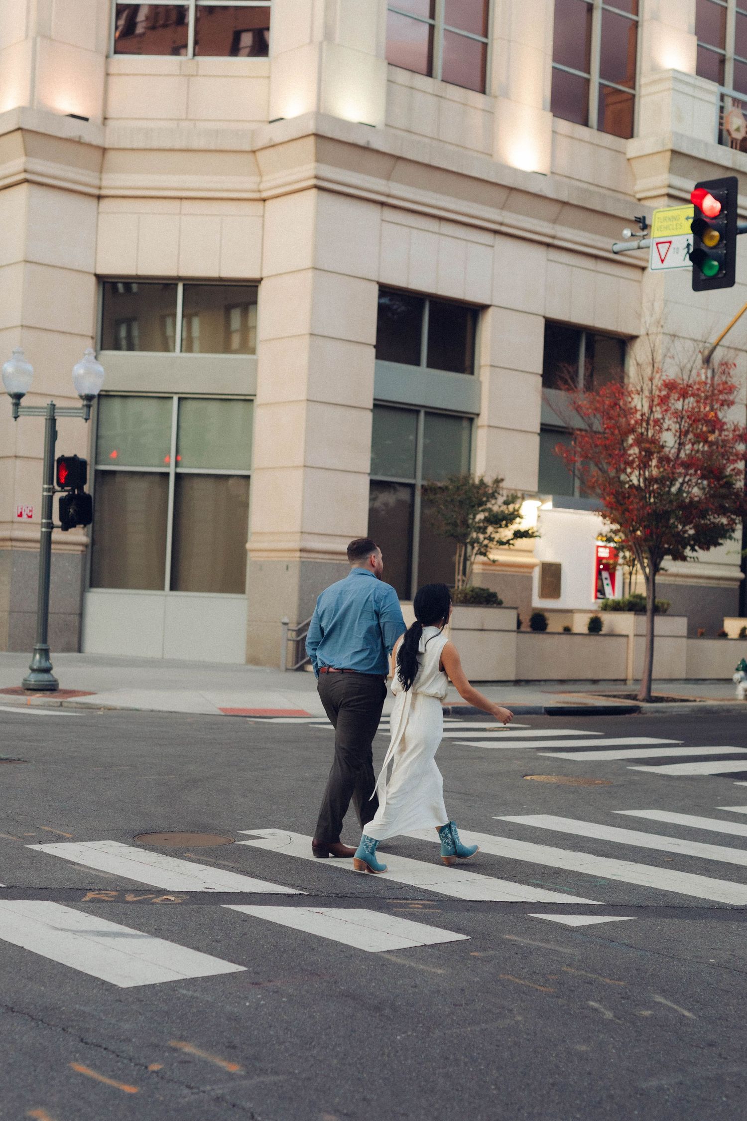 Time-lapse sequence showing pedestrians crossing a striped crosswalk in an urban setting.