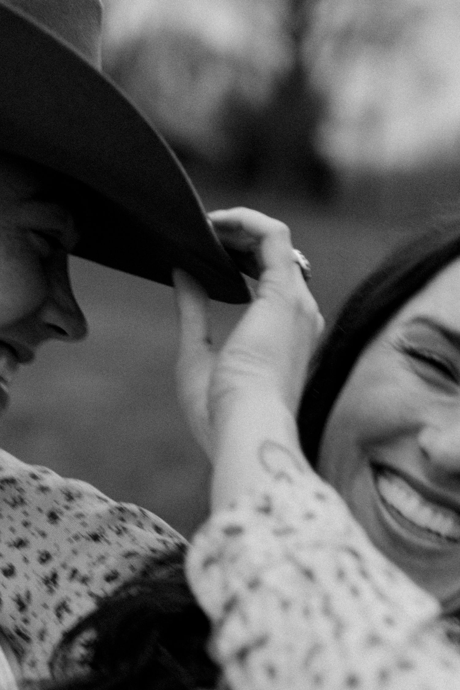 Black and white image showing joyful candid laughter and connection.