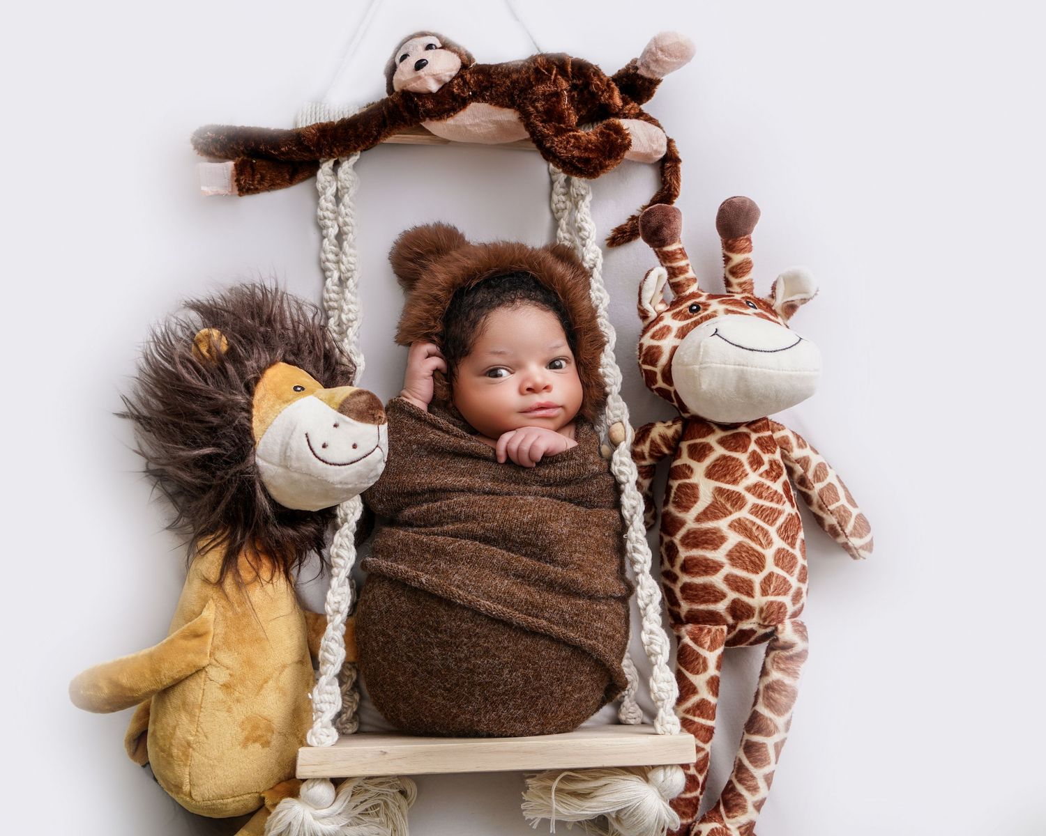 Newborn baby portrait in South Carolina, soft natural light, cozy wrapped infant photography, timeless heirloom style