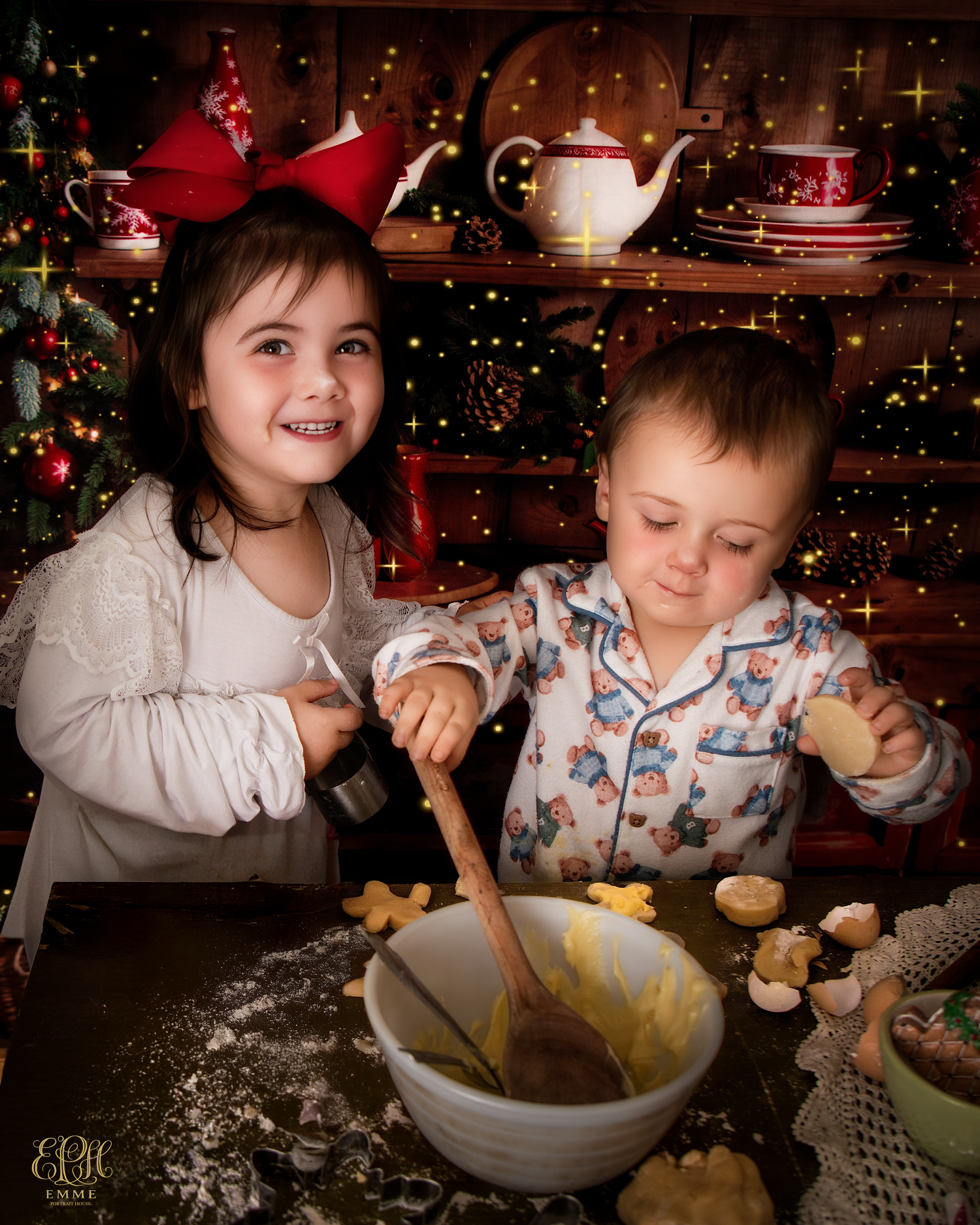 Two children baking Christmas cookies together, surrounded by festive decorations and a glowing Christmas tree in Orangeburg, SC