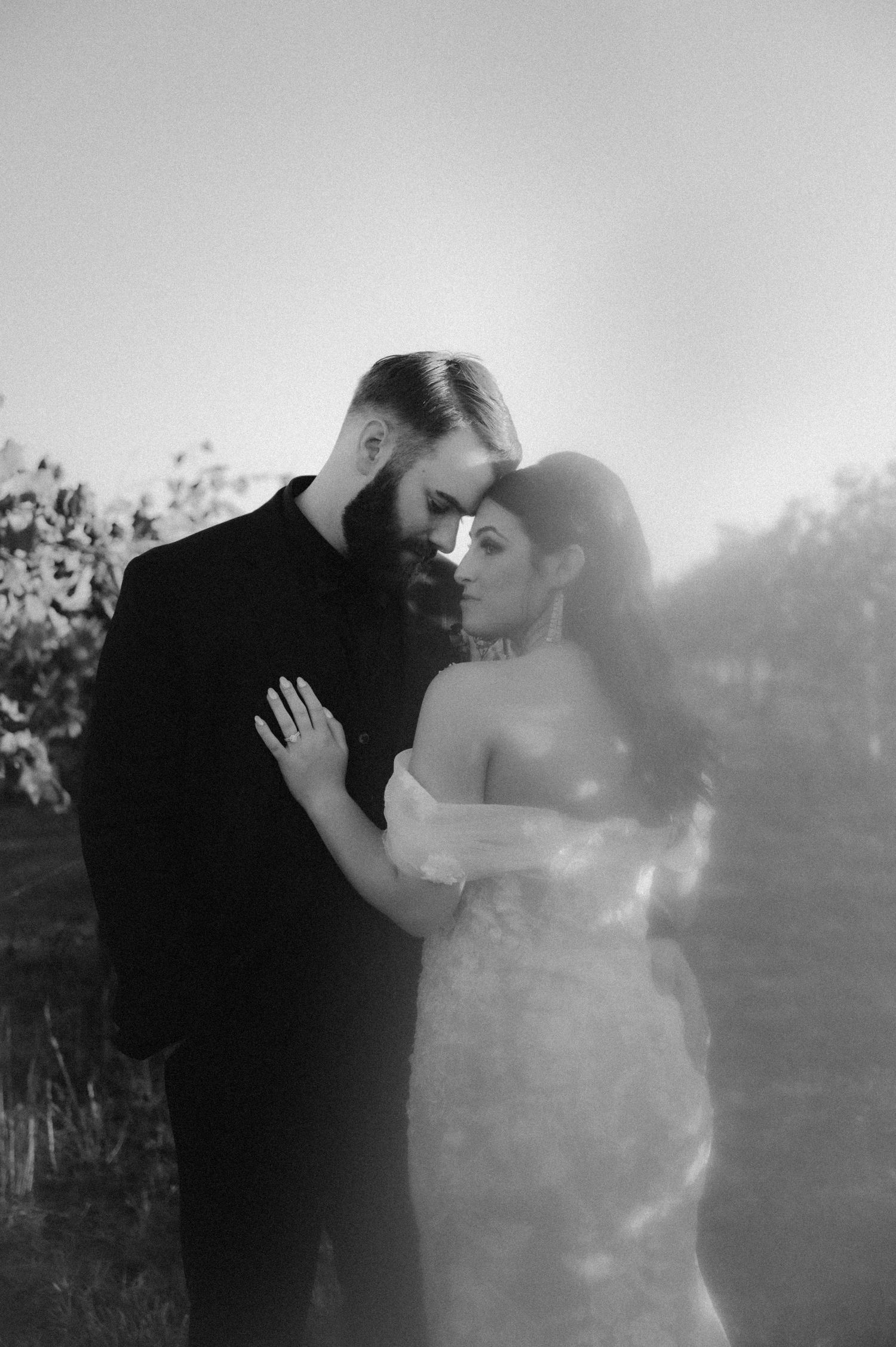 Indiana Wedding and Elopement Photographer // Dreamy black and white wedding portraits with sunlight streaming through trees.