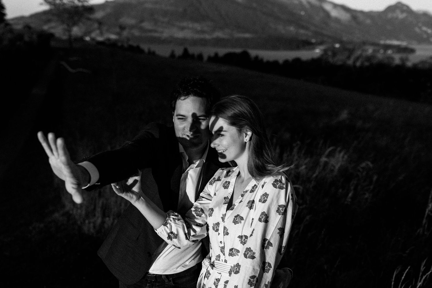 A series of black and white landscape photographs showing mountain ranges and natural scenery.