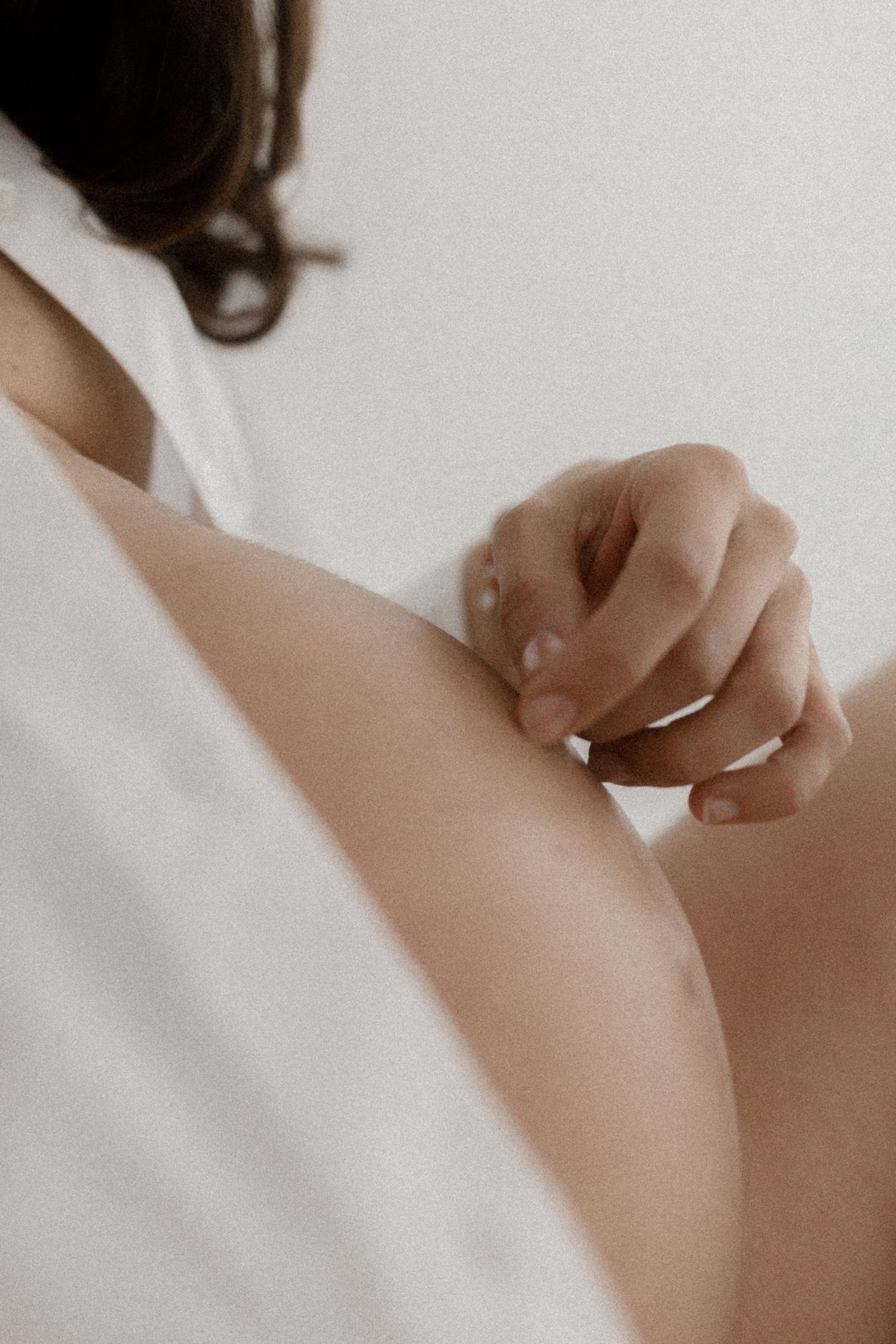Gentle intimate portrait showing soft skin tones in natural light.