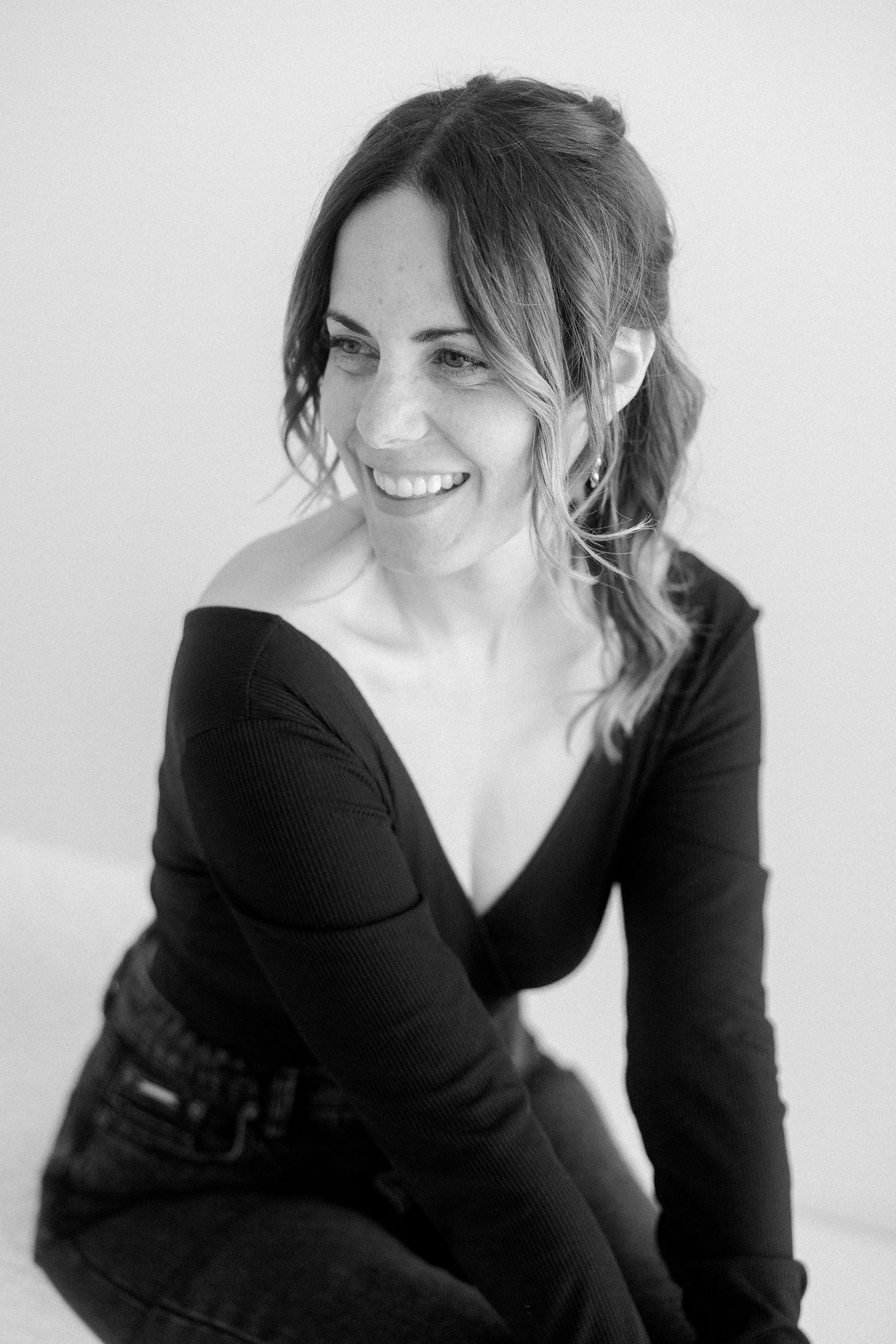 A series of black and white portraits showing a person in a black top with tousled hair against a light background.