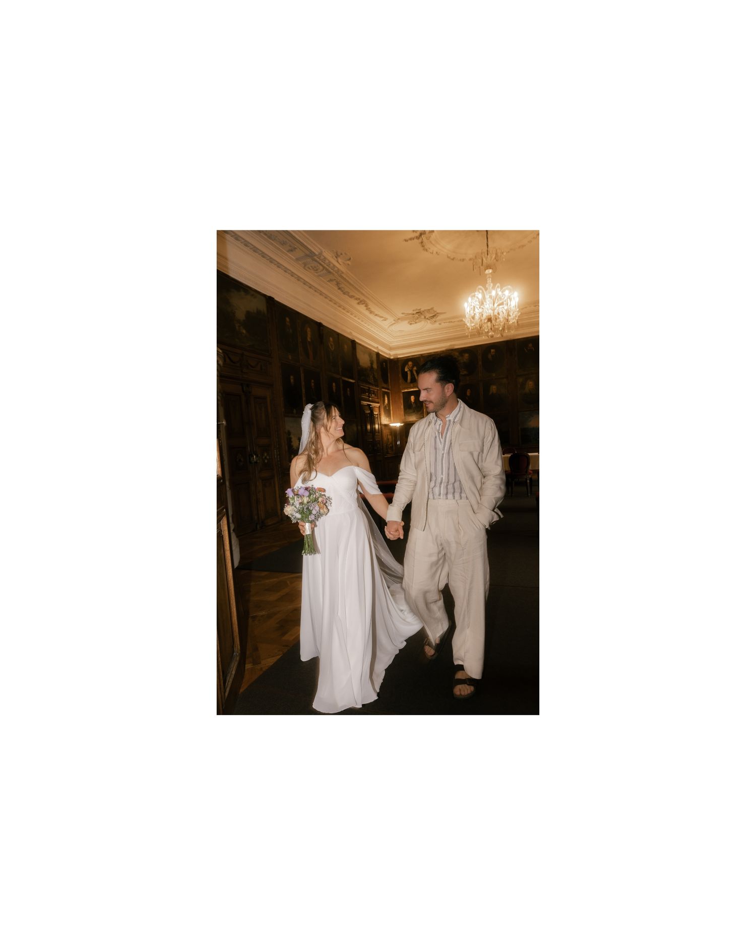 A couple shares a romantic dance moment during their wedding reception in an elegant ballroom setting. Rathaus Luzern