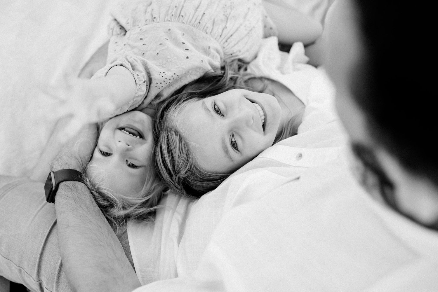 Intimate black and white close-up portraits capturing tender sleeping moments.