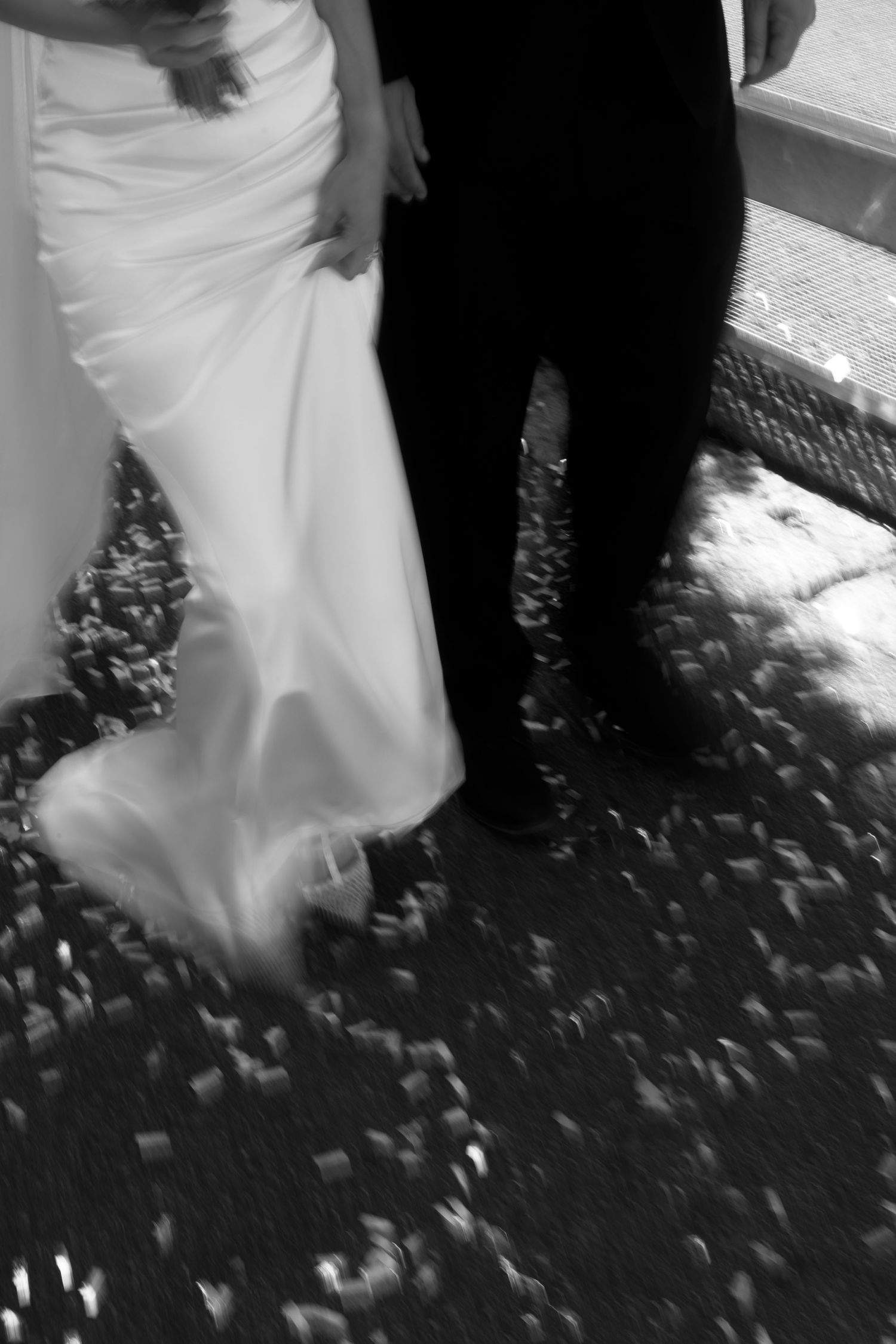 Black and white photo of a bride's white dress flowing during a dance movement at Rathaus Luzern.