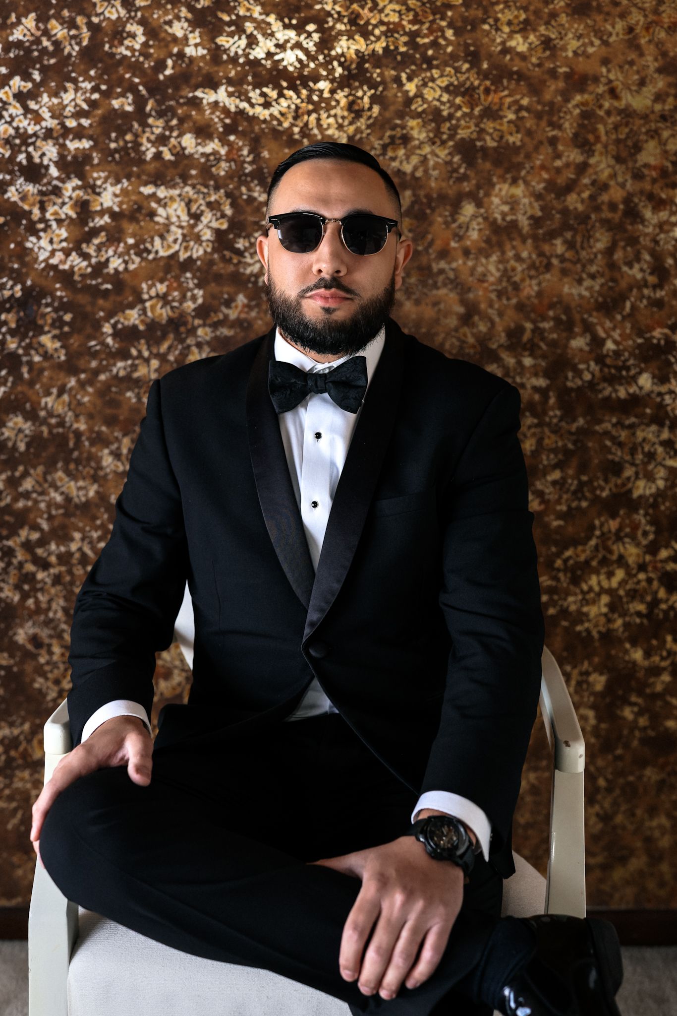 Luxury Chicago & destination wedding photographer captures groom in designer Gucci tie. Sophisticated, high-end bridal.