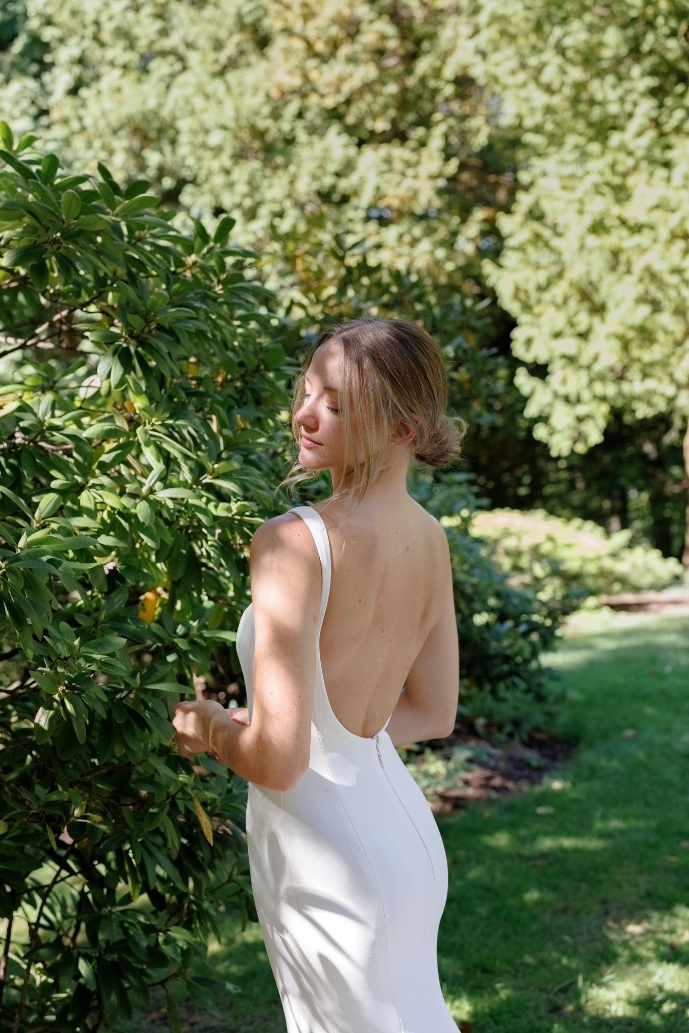 Luxury Chicago wedding photographer captures fine art, editorial-style portrait of bride in designer wedding dress during summer wedding.