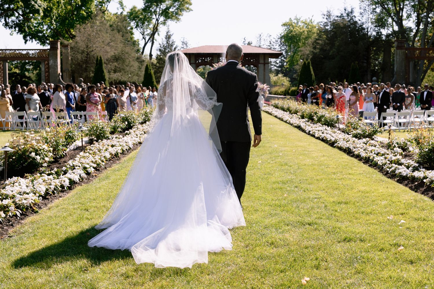 Armour House at Lake Forest Academy wedding with bride walking down the garden aisle, beautifully captured by Chicago  luxury photographer.