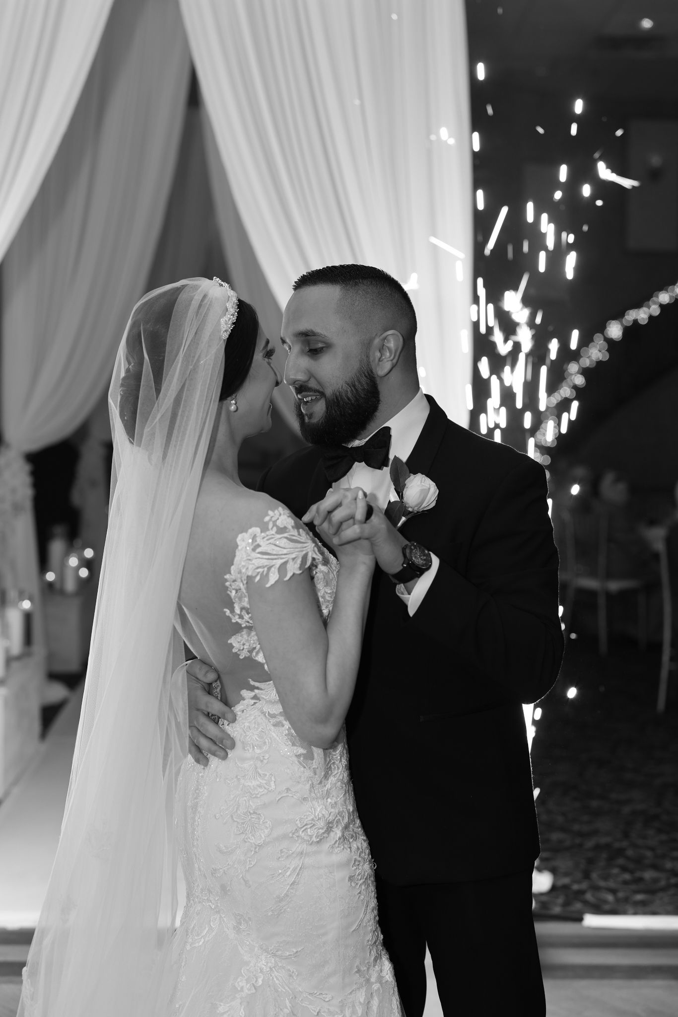 Bride and groom’s first dance at reception with sparklers, captured by luxury Chicago wedding photographer in editorial documentary style.