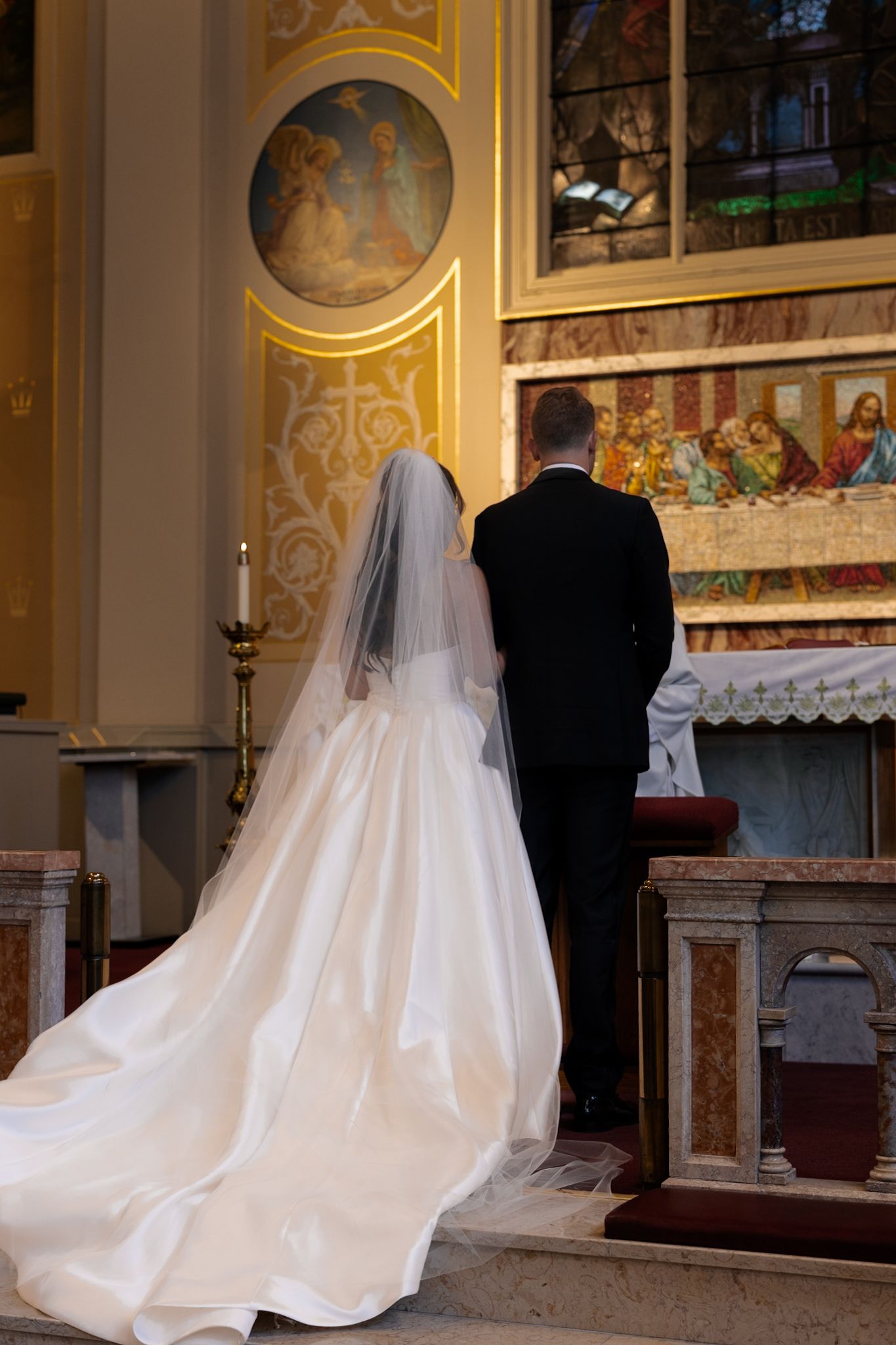 Bride and groom at ceremony at Assumption Catholic Church Chicago, captured by luxury Chicago wedding photographer in documentary style.