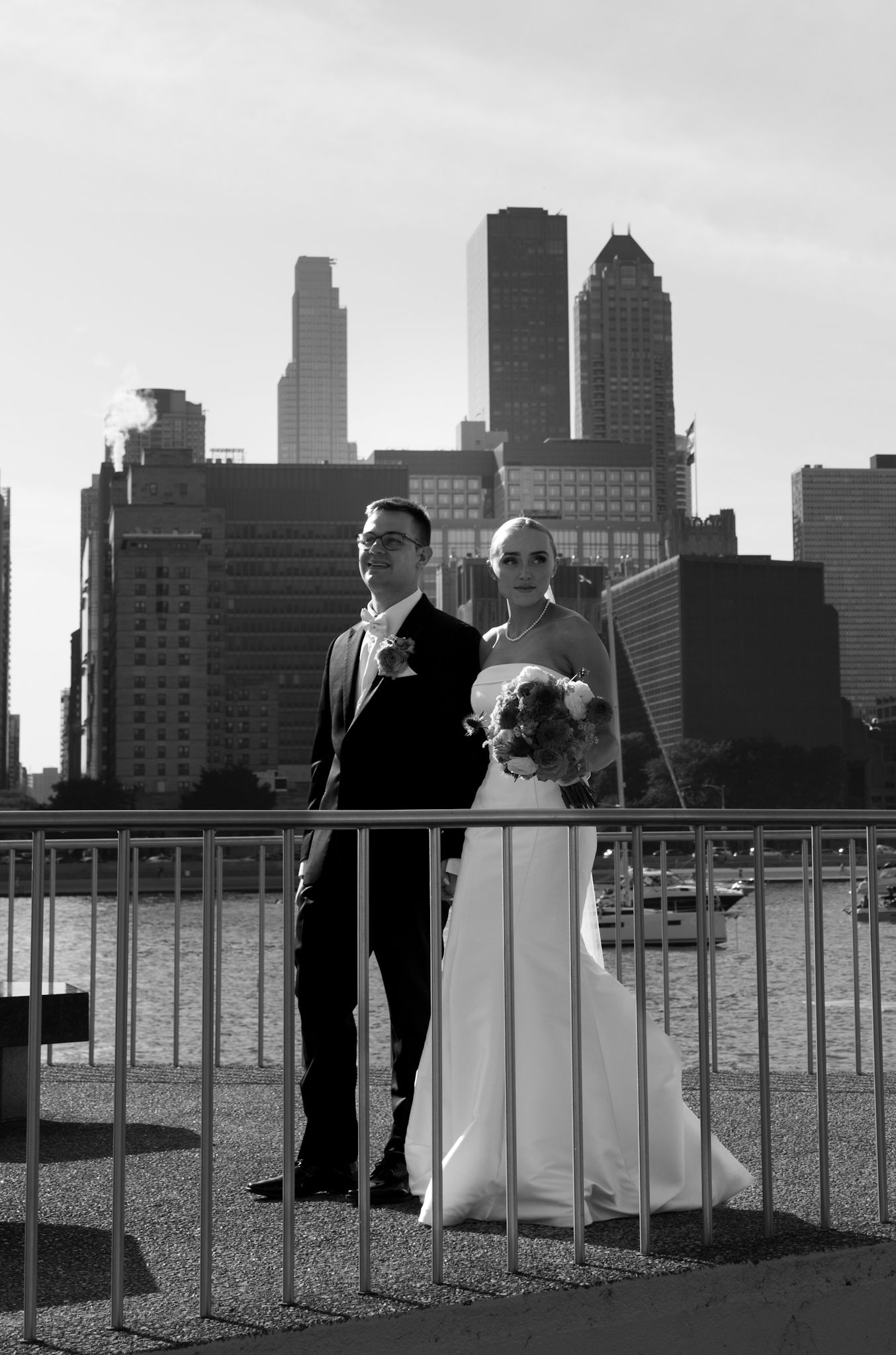 Bride and groom at Chicago Riverwalk, captured by a luxury Chicago wedding photographer specializing in documentary and editorial style.
