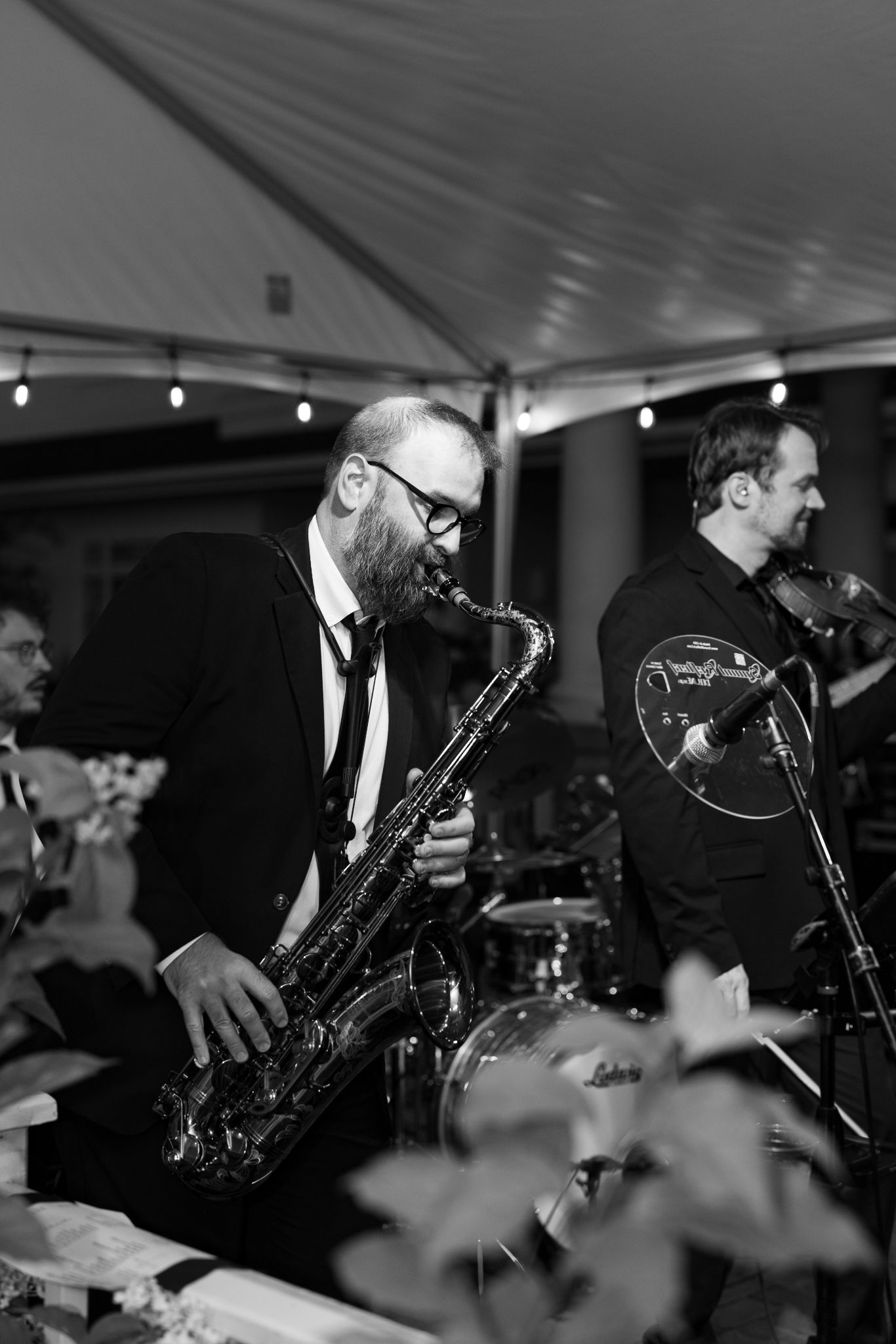 Luxury Chicago wedding photographer captures candid documentary and editorial-style photo of band member performing during wedding reception