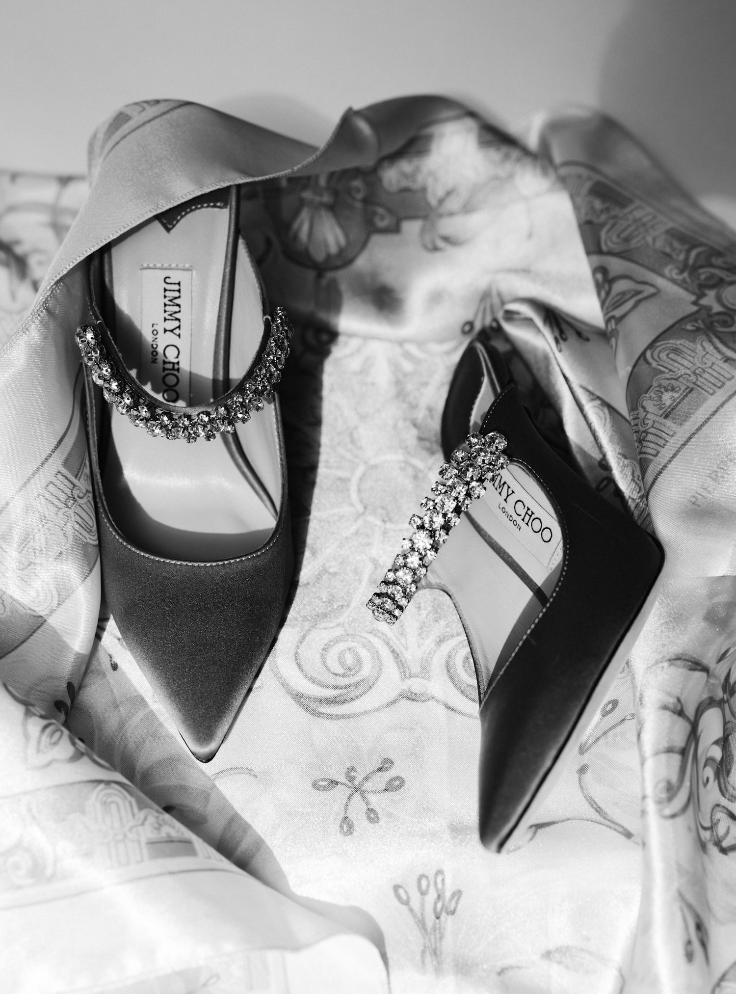 Jimmy Choo Bing 100 bridal shoe elegantly photographed by a Chicago wedding photographer specializing in luxury editorial photography.