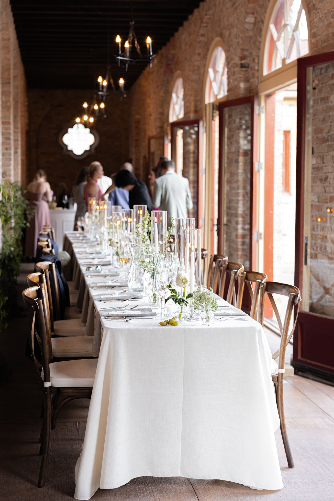 Chicago and destination luxury photographer captures long Italian-style floral tablescape in Michigan using editorial photography style.