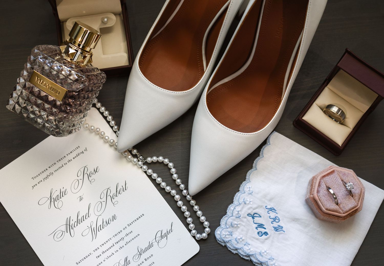 Luxury bridal detail shot featuring Amina Muaddi bridal shoe and perfume captured by luxury Chicago wedding photographer in editorial style.