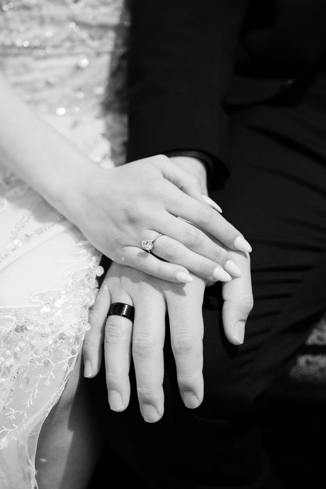 Designer Cartier band ring detail shot of bride and groom, captured by luxury Chicago wedding photographer in editorial documentary style.