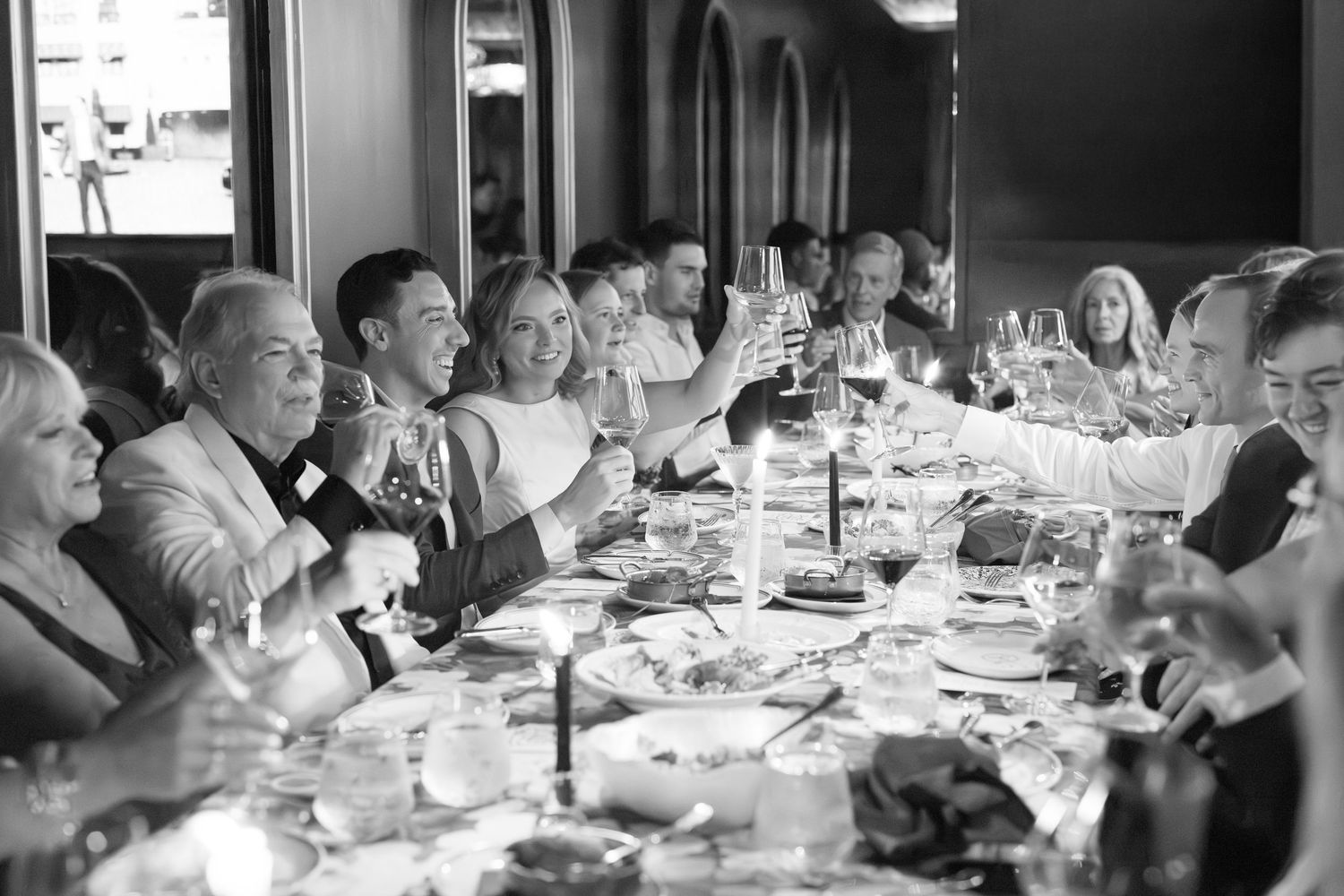 Bride and groom reacting to speeches at Chicago Winery wedding venue during dinner. Luxury waterfront wedding at Chicago Winery speeches.