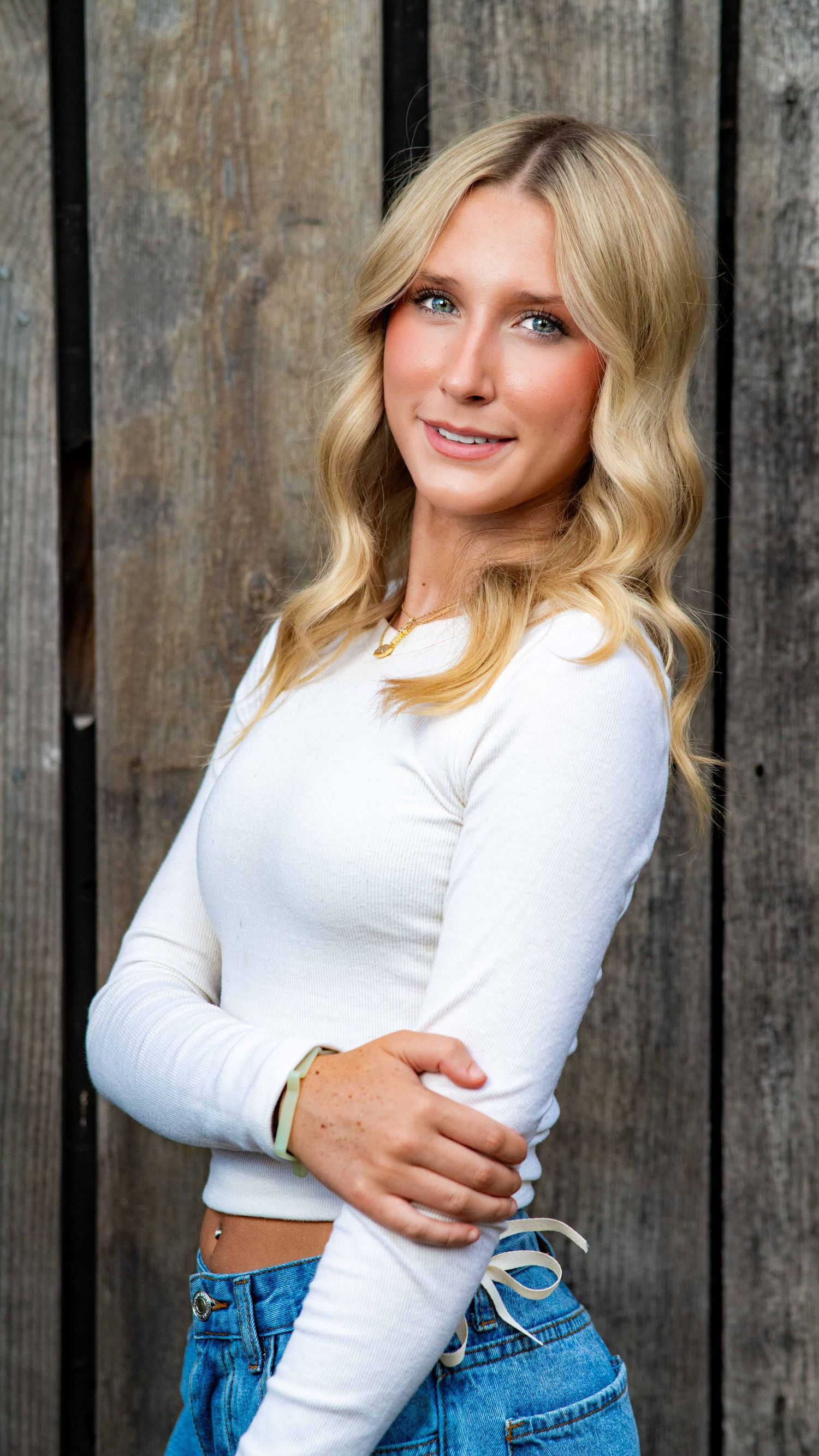 Natural-light headshot of a young woman outdoors