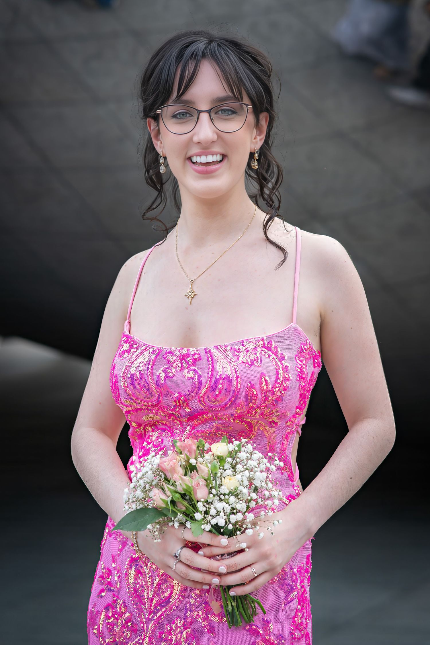 Elegant prom portrait against a dark background