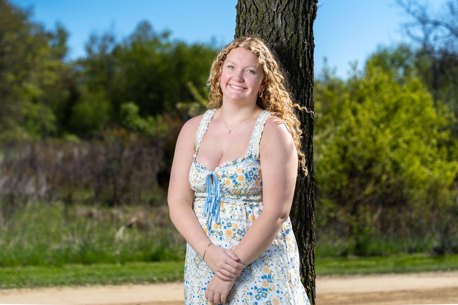 High school senior portrait outdoors in a floral dress, Lake County IL senior photography