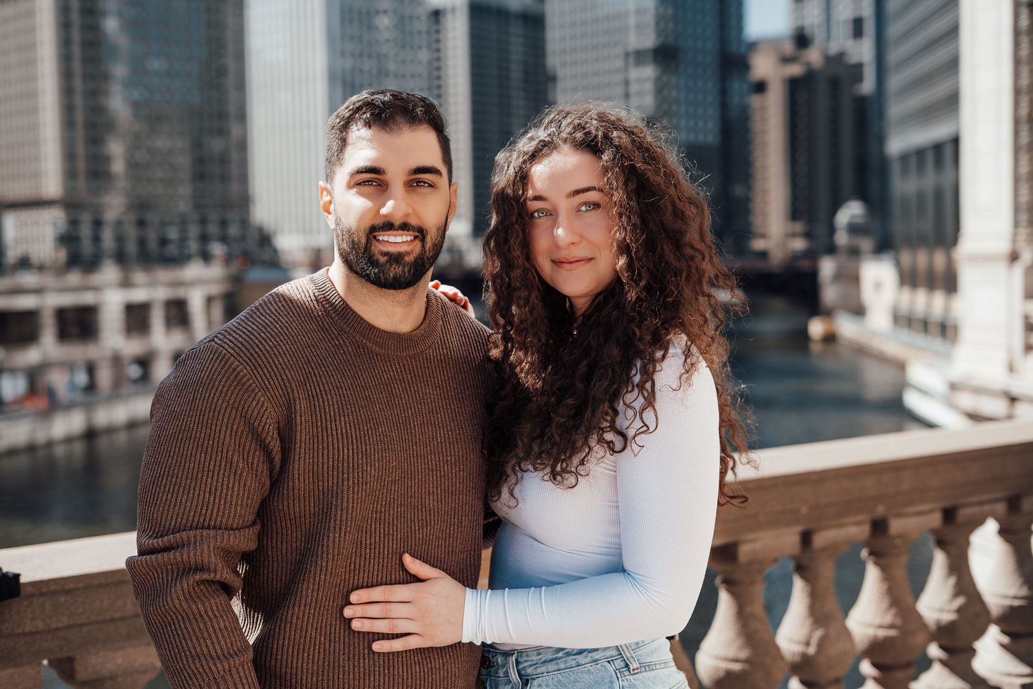 Couple embracing on a downtown Chicago bridge, couples portrait