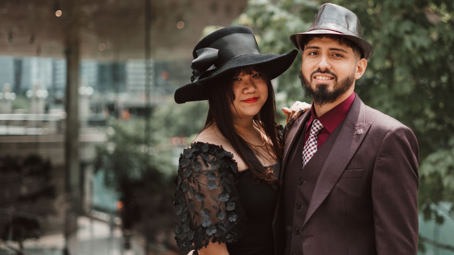 Stylish couple in hats posing together, engagement photography