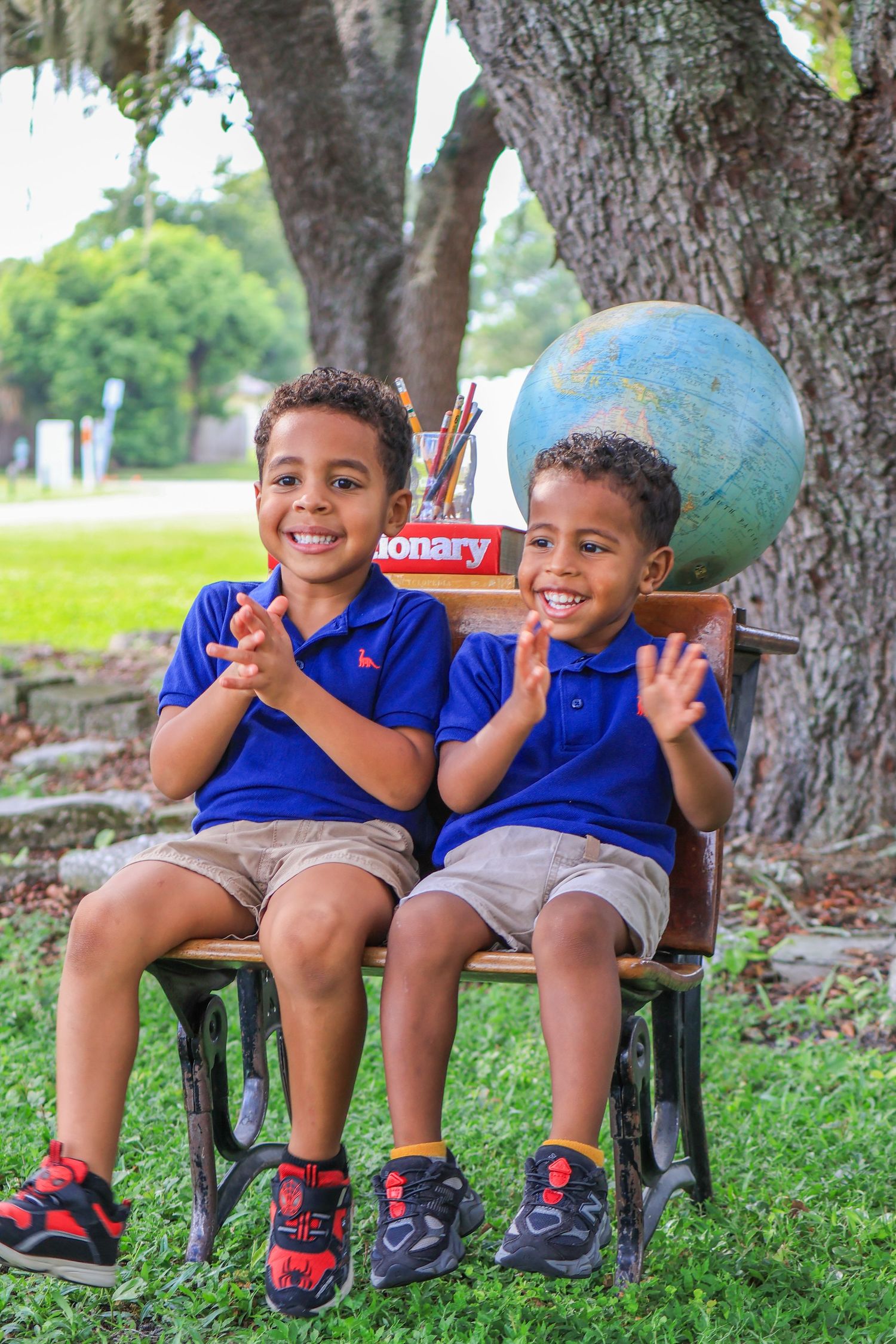 happy pictures of kids starting VPK with vintage school desk in orlando photographer