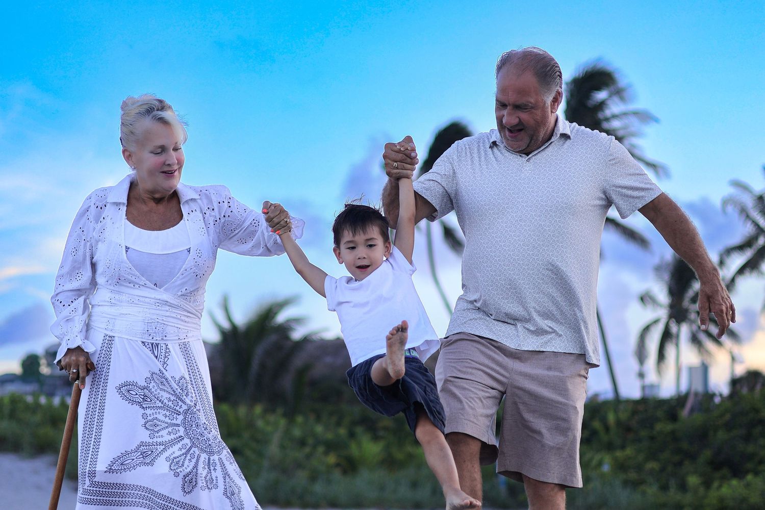 playful swinging beach family and grandparent photoshoot near orlando, florida