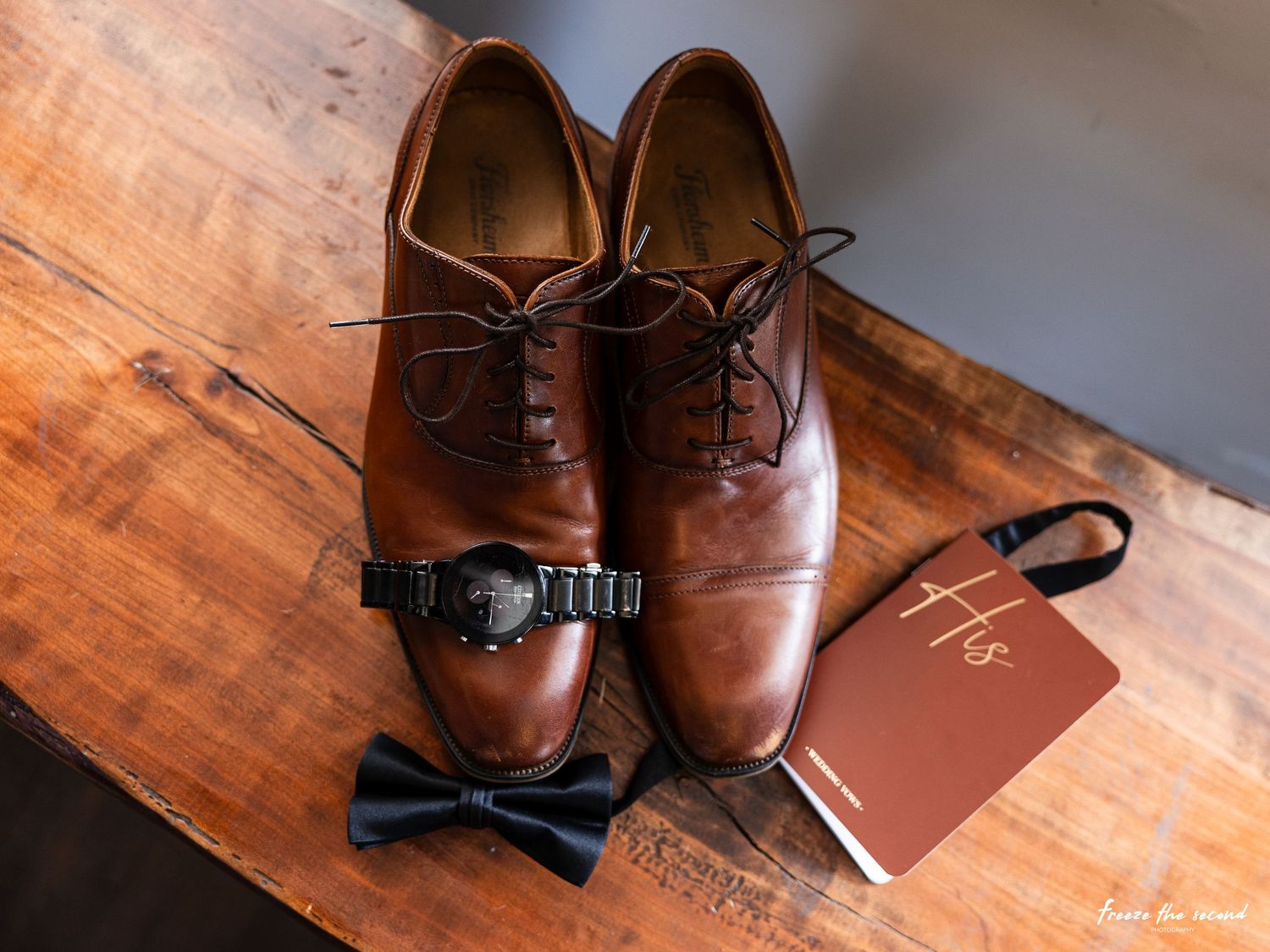 Brown leather dress shoes arranged in different angles on a wooden surface to showcase their craftsmanship and design details.