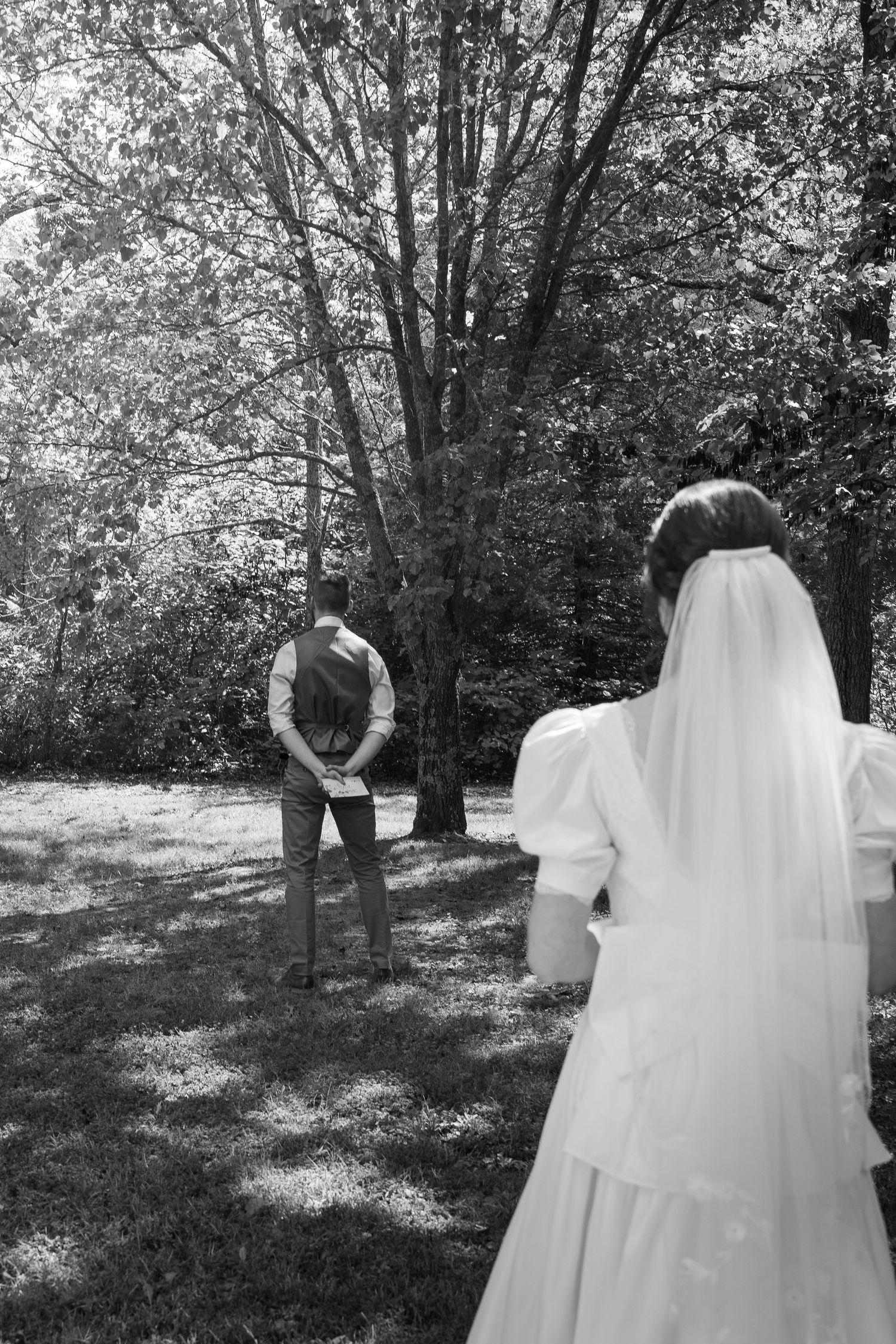©AnnaVonRiesenPhotography Wedding Photography | B&W image of a bride walking towards her groom.
