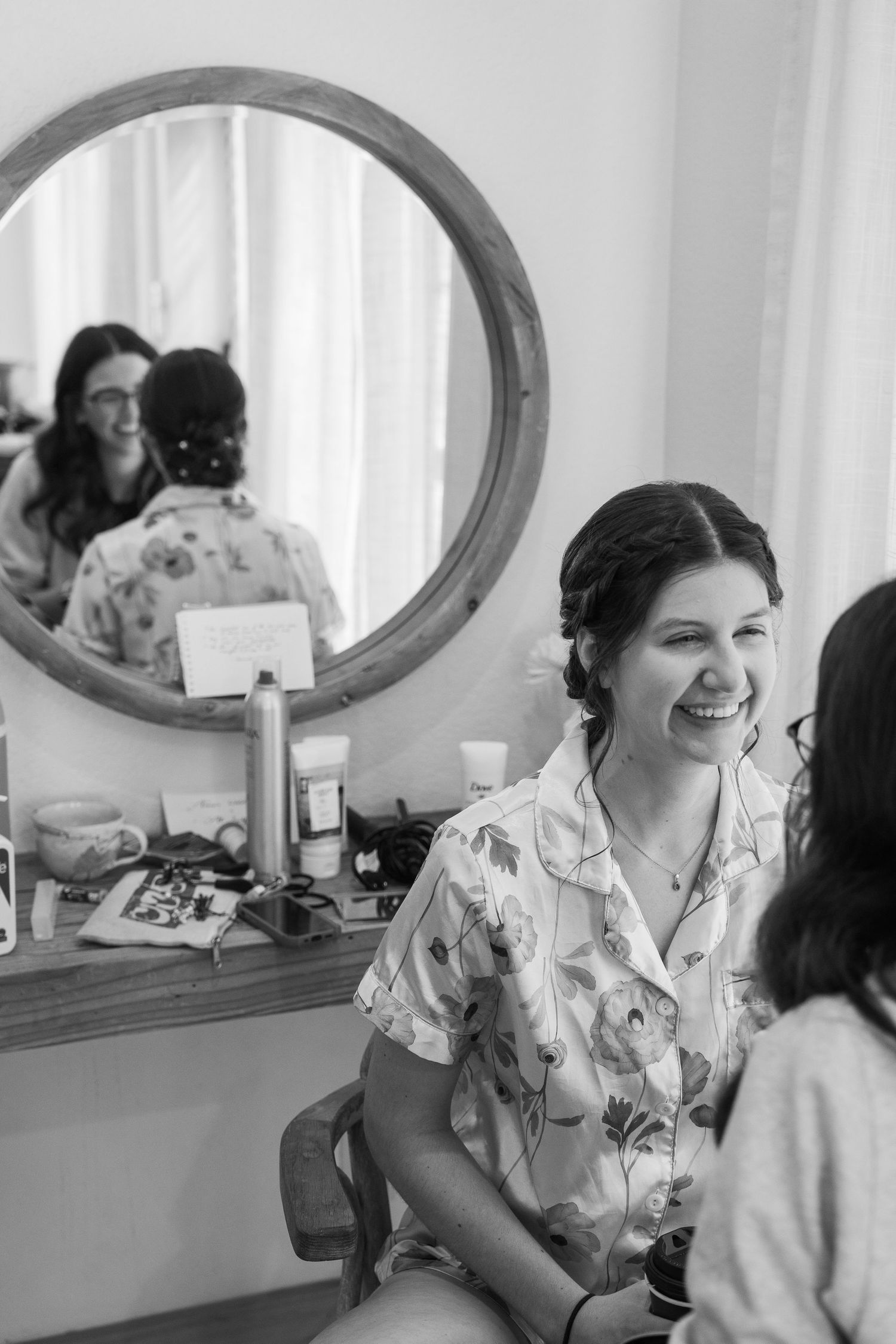 ©AnnaVonRiesenPhotography Wedding Photography | B&W image of the bride smiling as her makeup gets done.