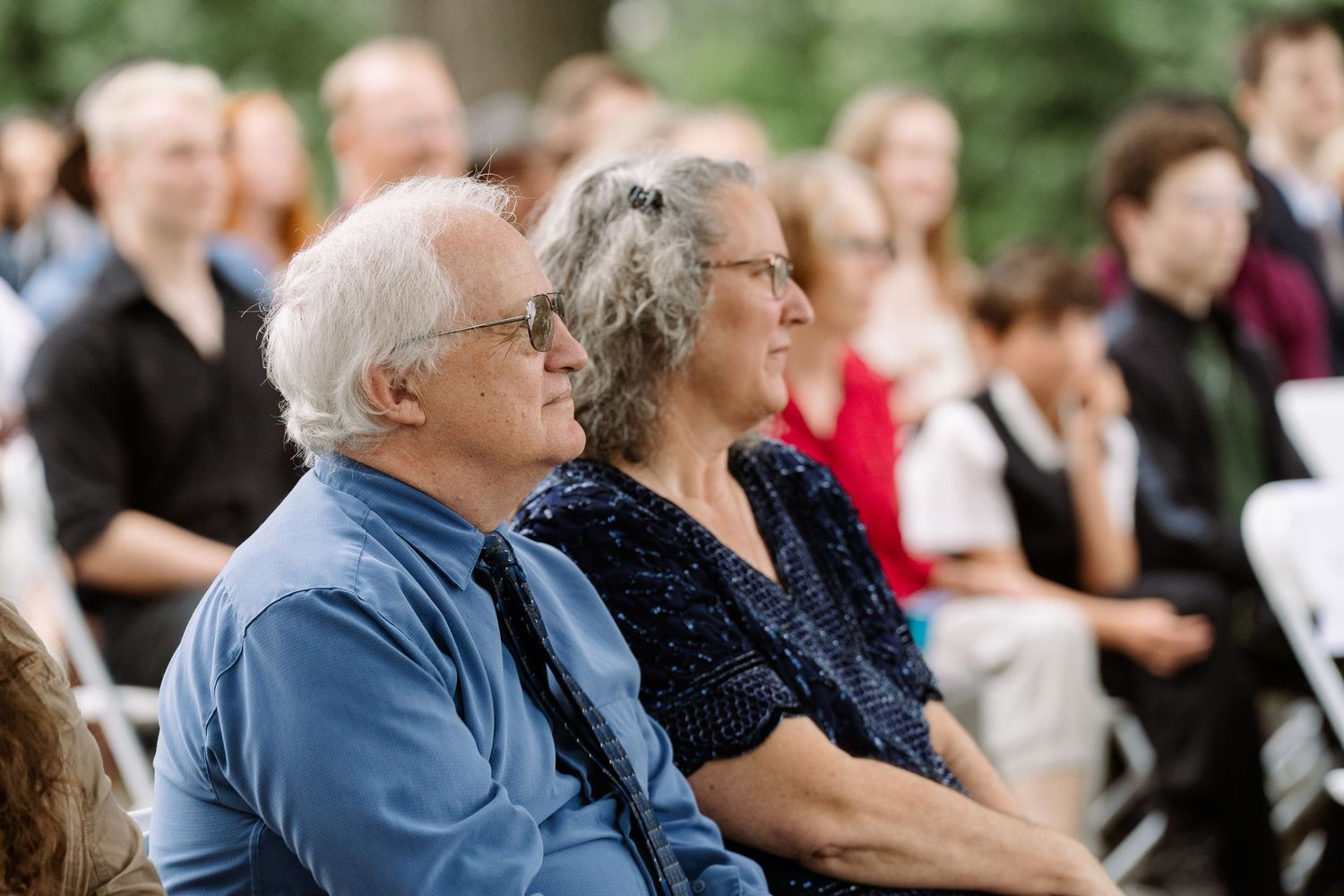 ©AnnaVonRiesenPhotography Wedding Photography | Color image of the groom's parents during the ceremony.