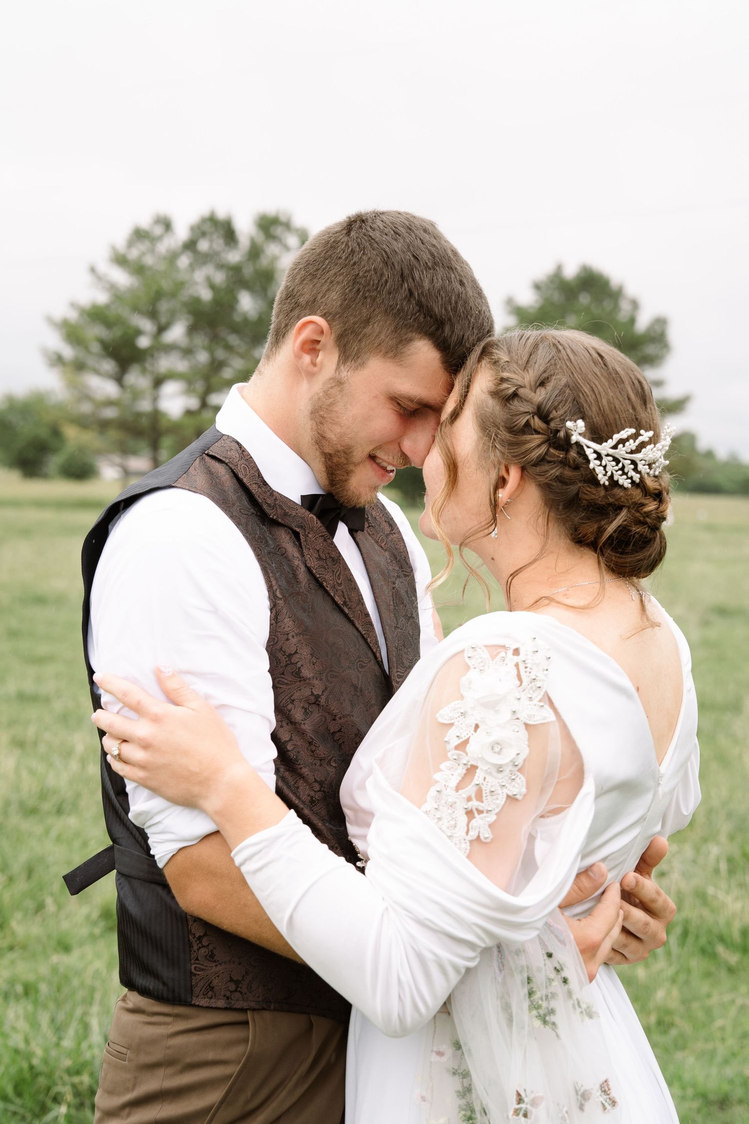 ©AnnaVonRiesenPhotography Wedding Photography | Color image of the bride & groom touching foreheads & holding each other.