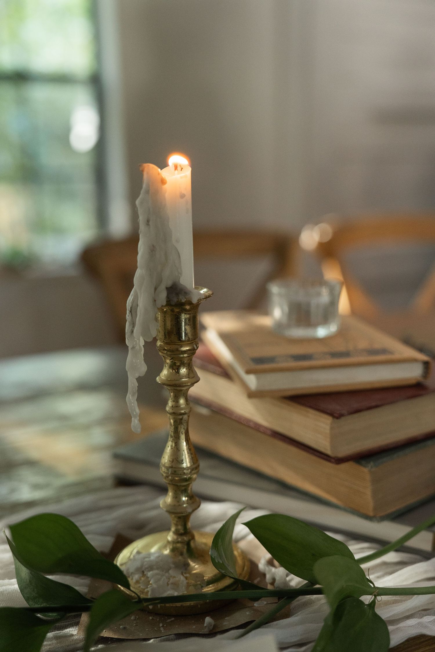 ©AnnaVonRiesenPhotography Wedding Photography | Color image of a candle in the reception hall.