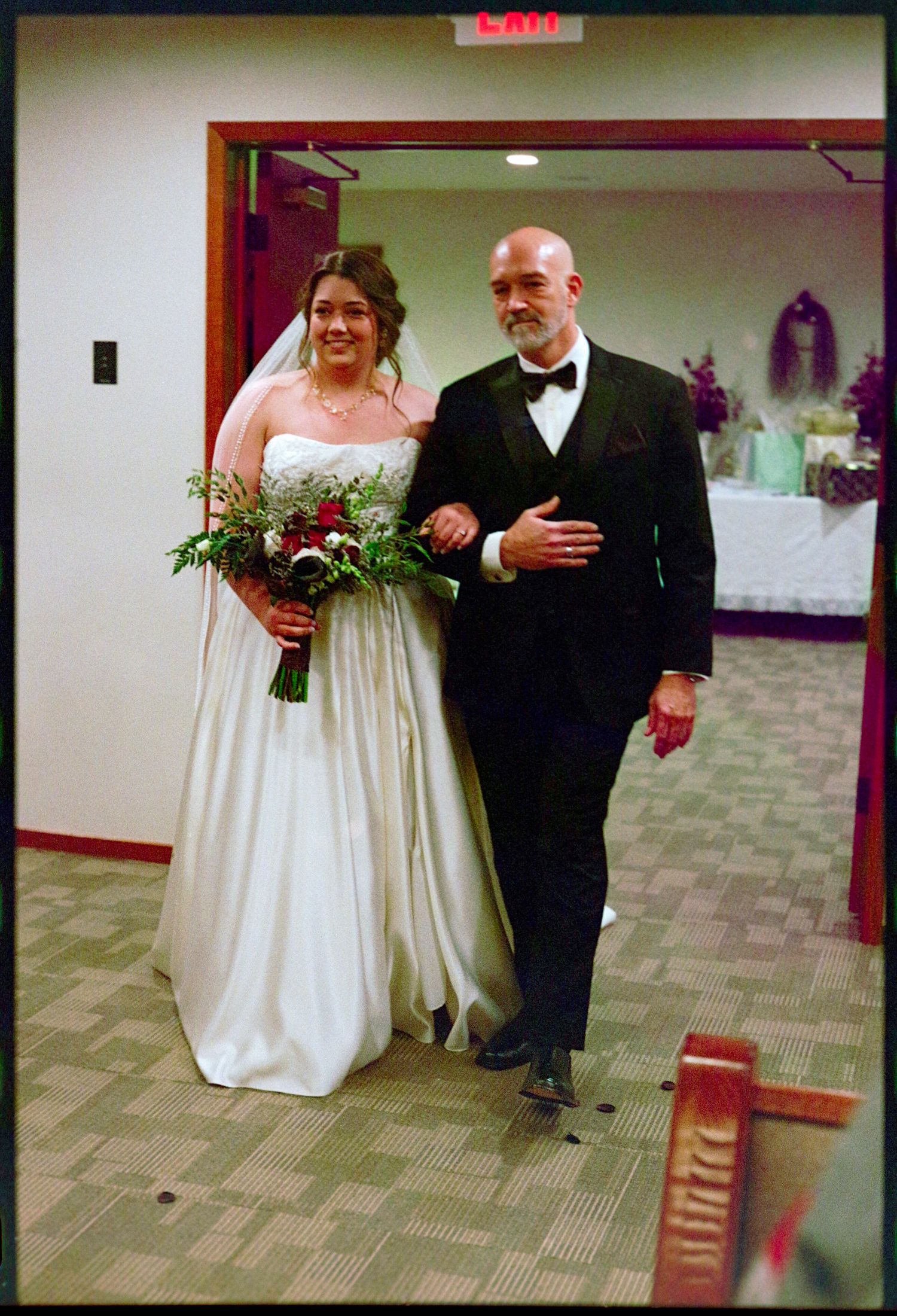 ©AnnaVonRiesenPhotography Wedding Photography | Film Color image of the bride walking down the aisle with her father.
