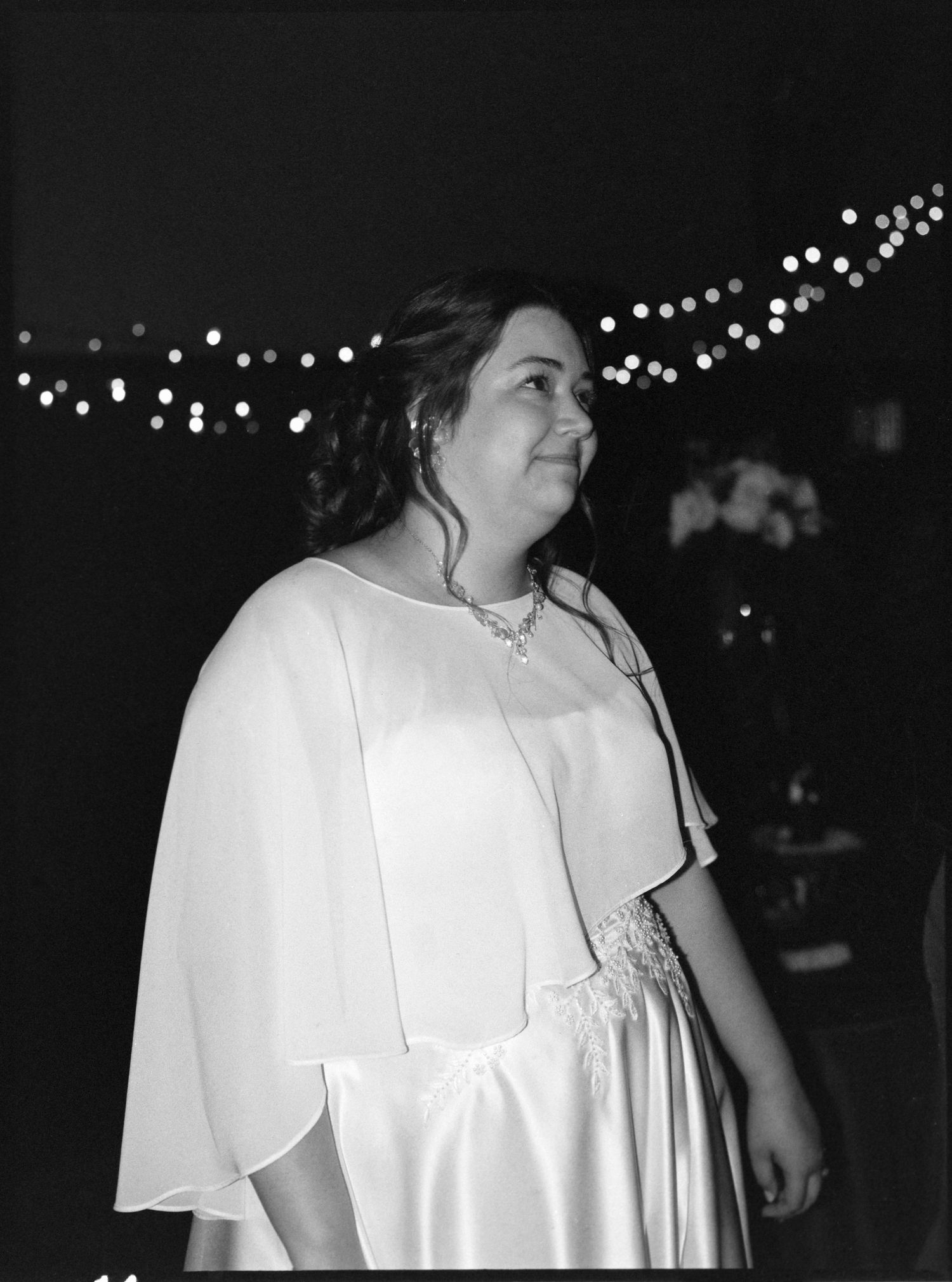 ©AnnaVonRiesenPhotography Wedding Photography | Film B&W image of the bride smiling as she greets guests.