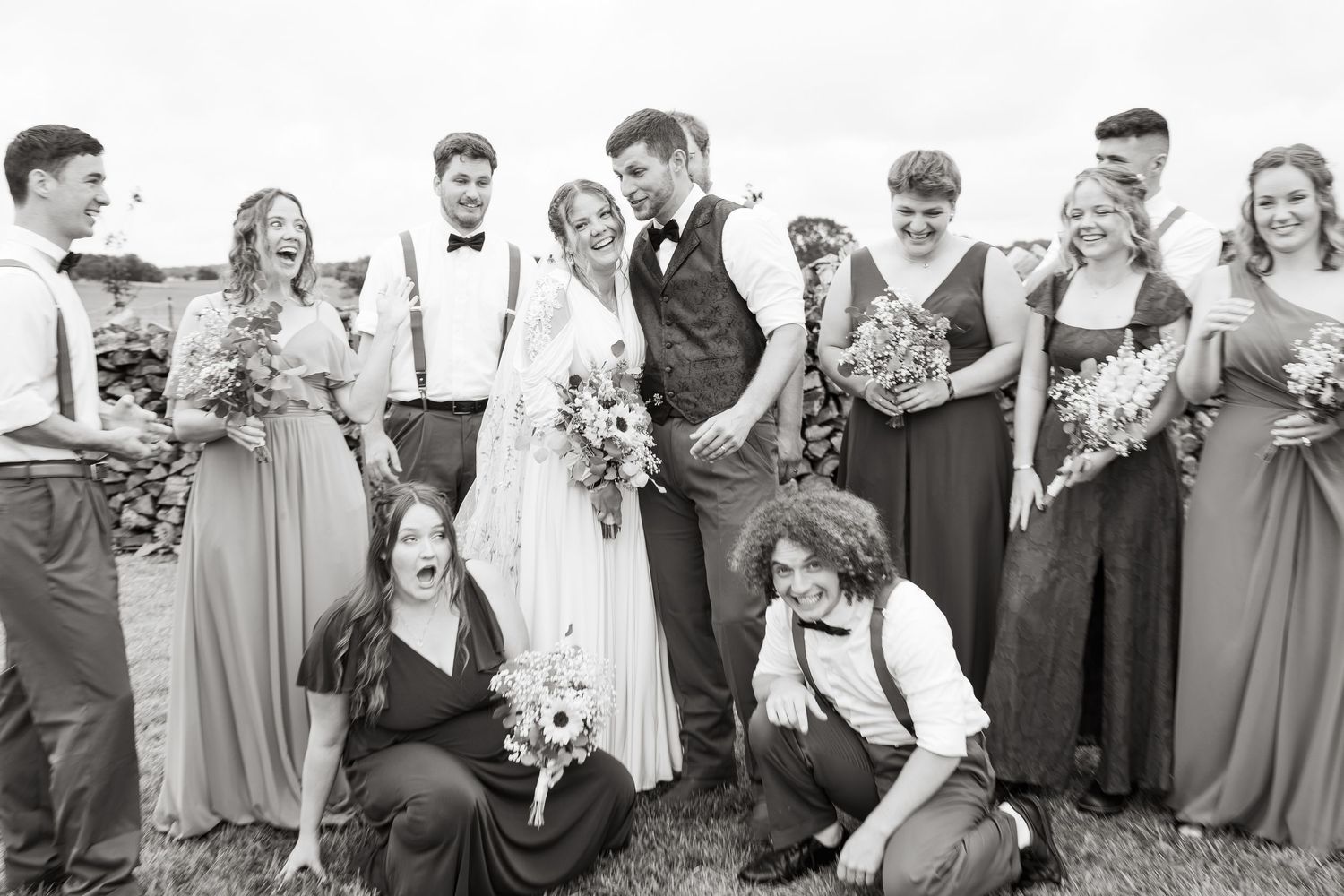 ©AnnaVonRiesenPhotography Wedding Photography | B&W image with the bridal party smiling & laughing.