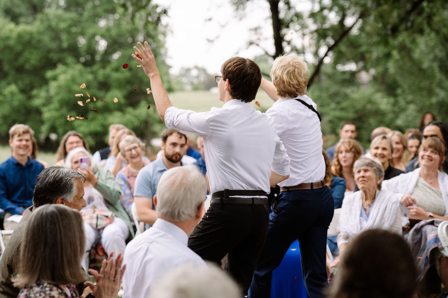©AnnaVonRiesenPhotography Wedding Photography | Color image of the flower boys tossing flowers.