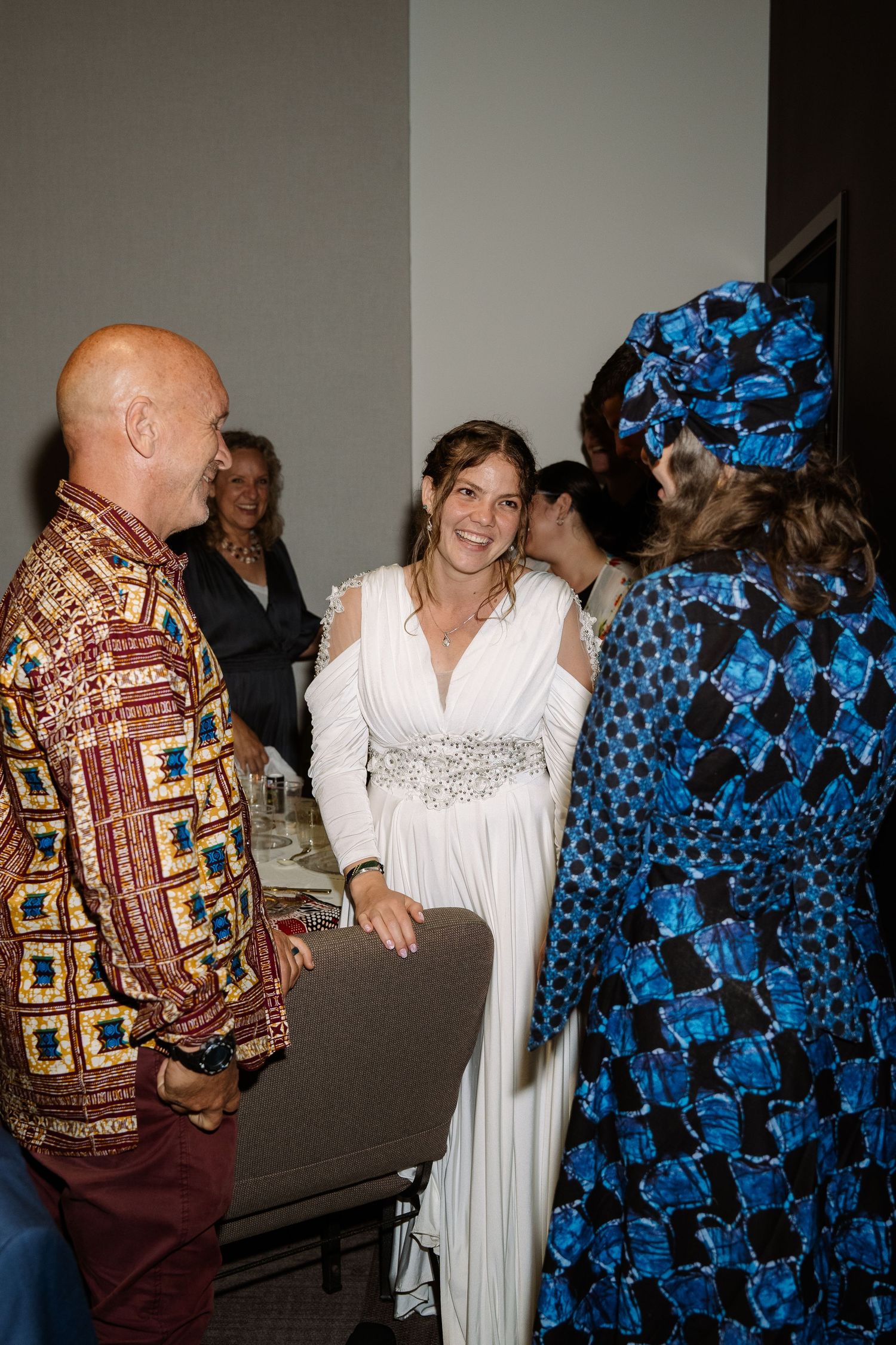 ©AnnaVonRiesenPhotography Wedding Photography | Color image of the bride greeting guests.