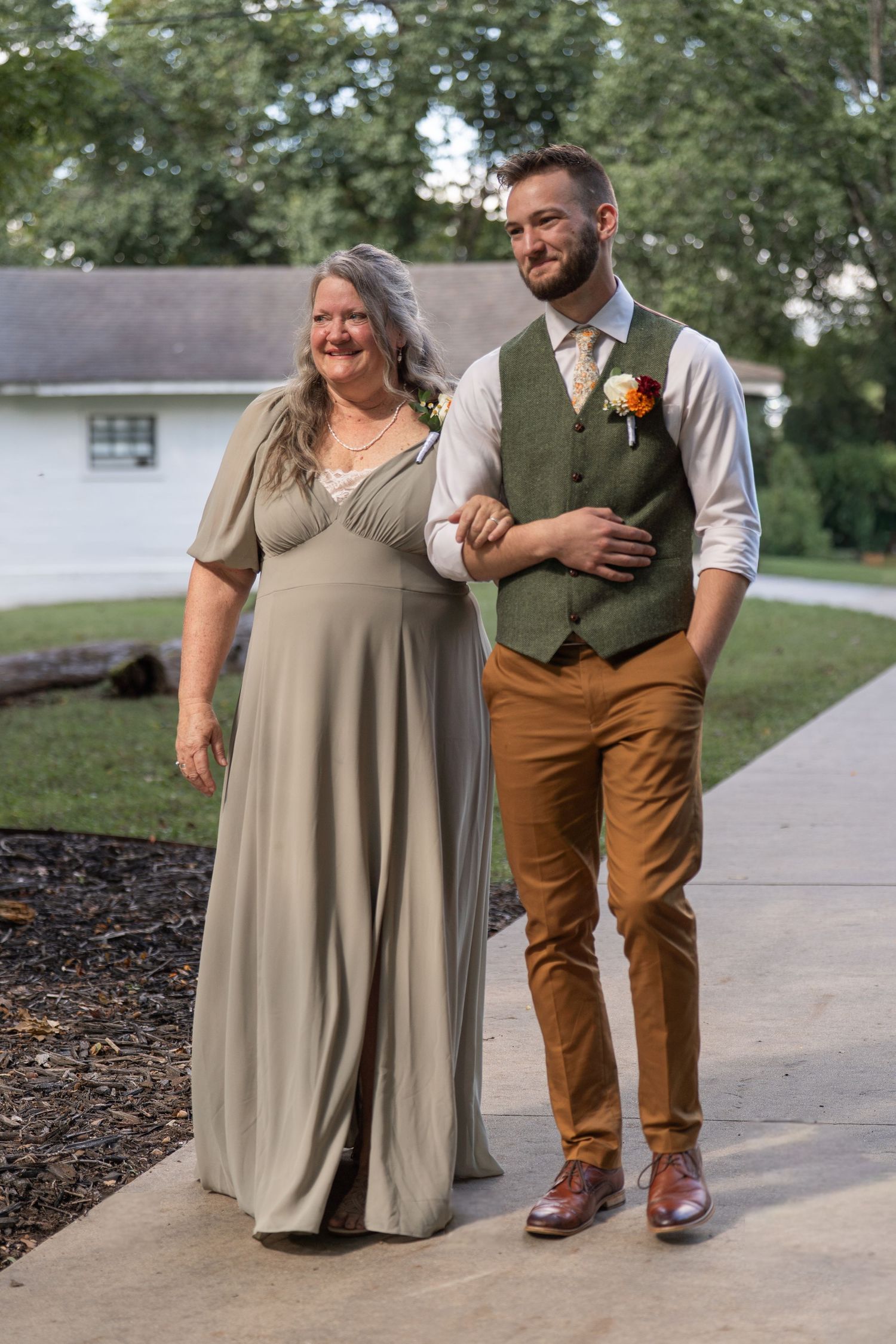 ©AnnaVonRiesenPhotography Wedding Photography | Color image of the groom walking with his mother down the aisle.