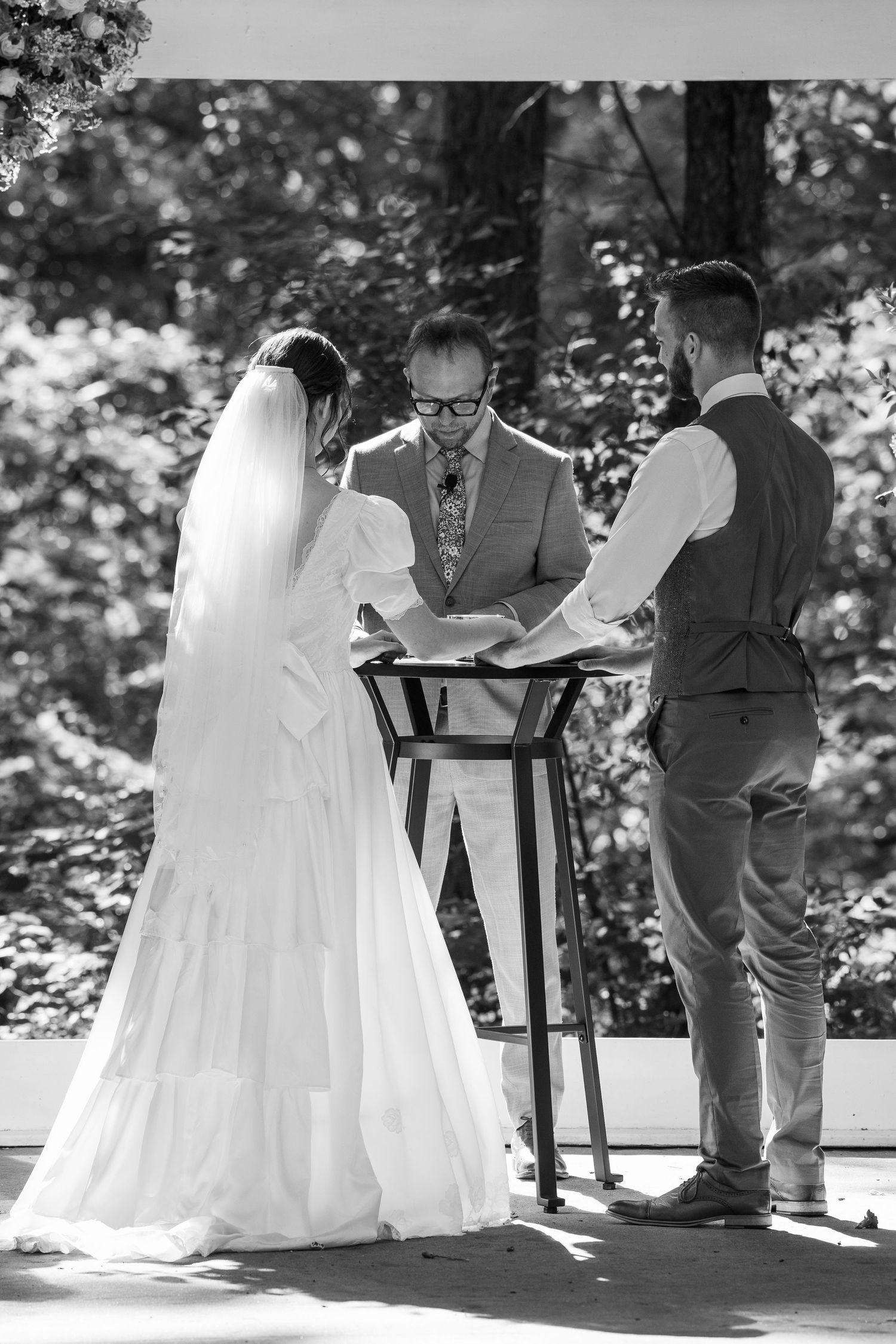 ©AnnaVonRiesenPhotography Wedding Photography | B&W image of the bride & groom taking communion together.